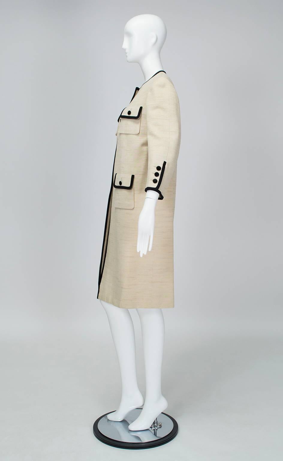 Famous for making ready-to-wear clothes with the same meticulousness that other designers reserved for couture, Norman Norell excelled when creating crisp, clean silhouettes that showcased his fastidious tailoring.  This contrast coat is the perfect