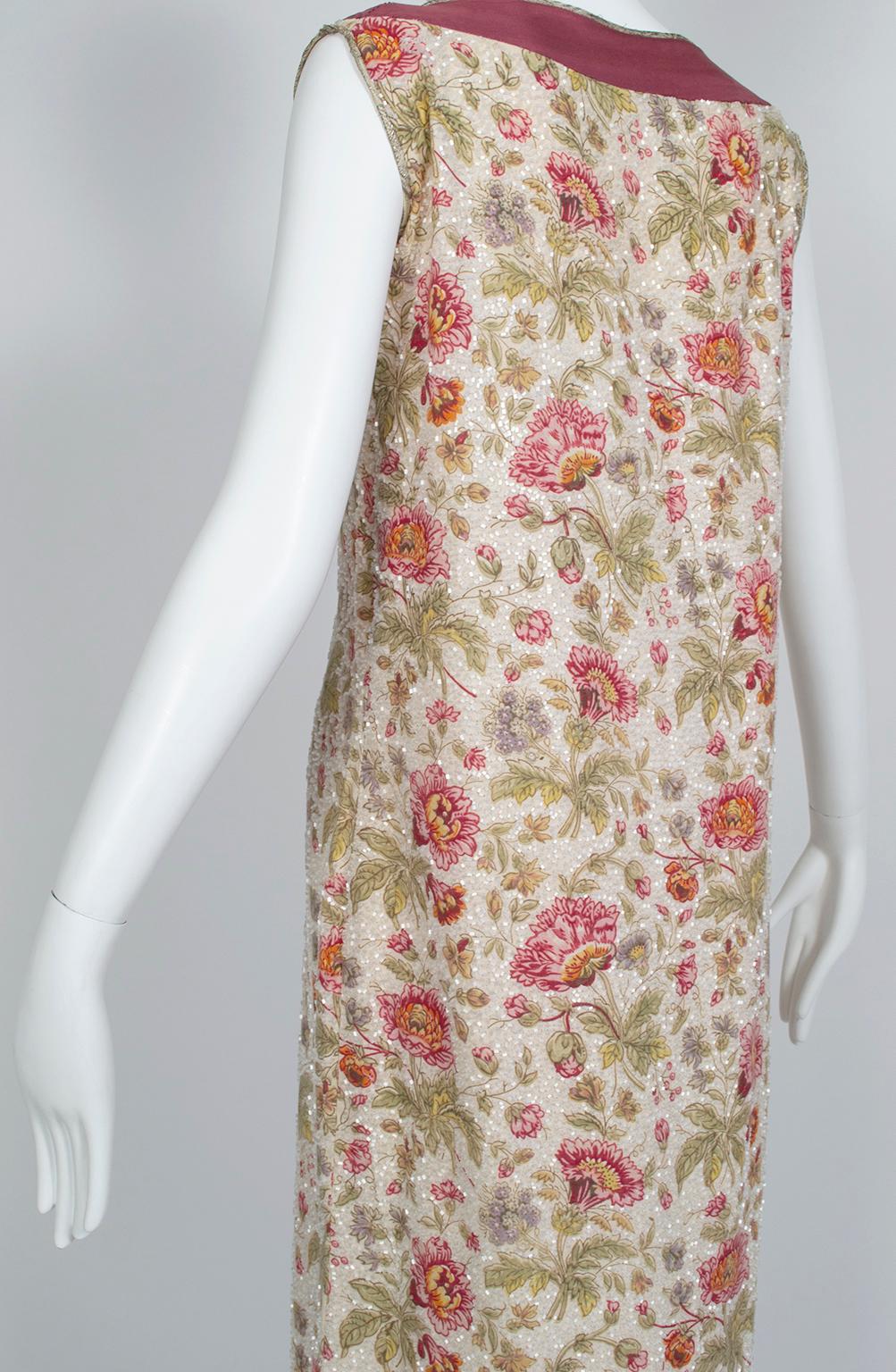 A rare larger size for a Jazz Age garment, this incredible dress offers the comfort of a shift with the elegance of formalwear thanks to its lustrous glass beads. We love how the flowers are left unbeaded for extra depth and texture. Areas where