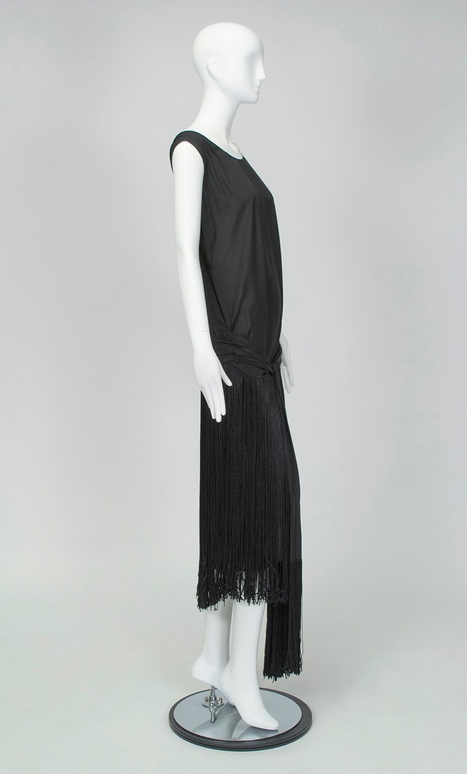 A transformative dress with a fetching shirred cummerbund that cups the tush and 2-foot fringe that never stops moving. Begs for a headpiece, garter flask and dance partner. 

Sleeveless flapper dress with plunging back, pintuck shoulders and