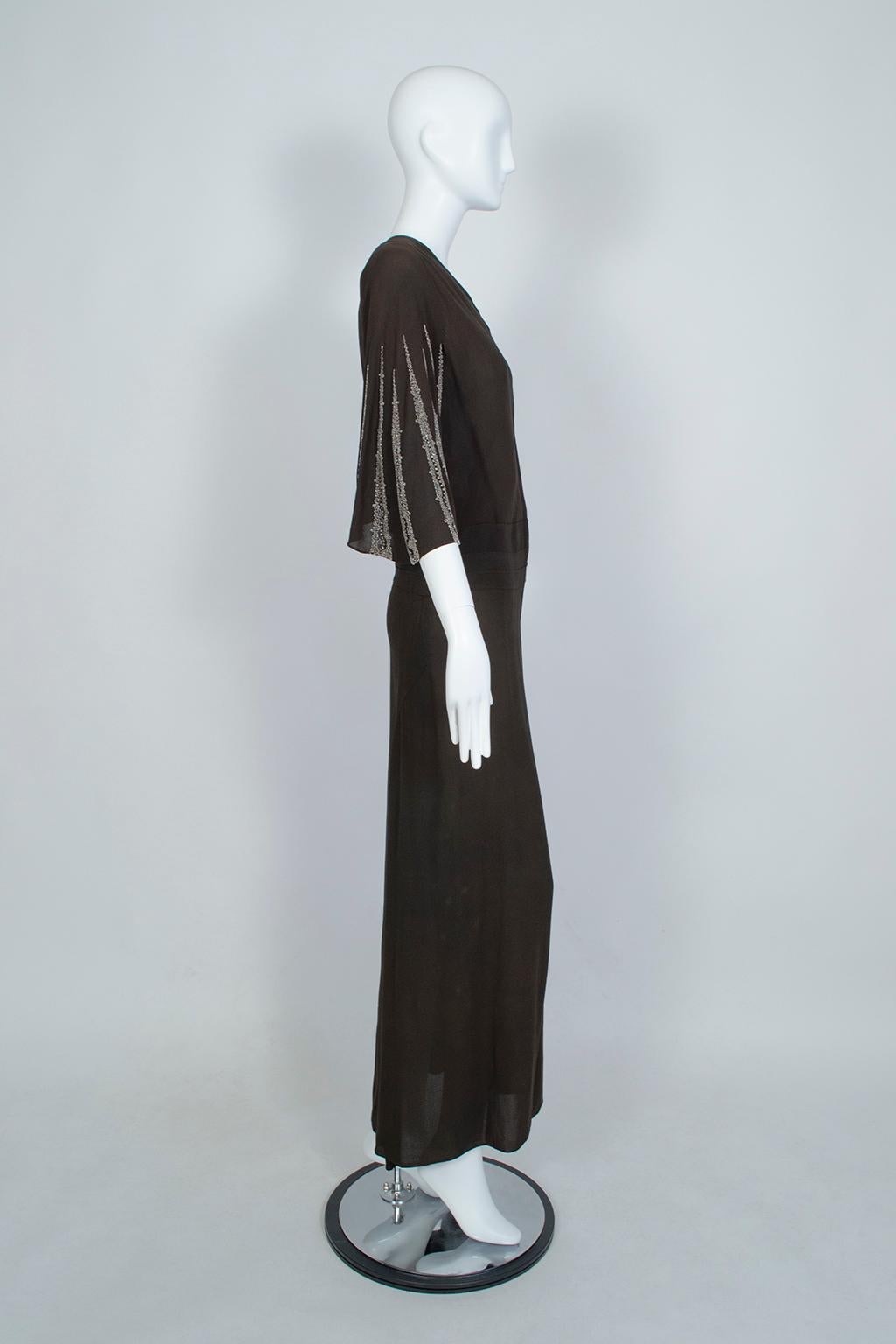 Dignified and statuesque, this gown combines the modesty and rigor of a kimono with the body conscious glamour of the 1930s. The high cut asymmetrical bodice and inset obi waist detail keep it demure, but the fluttering batwing sleeves—dripping with