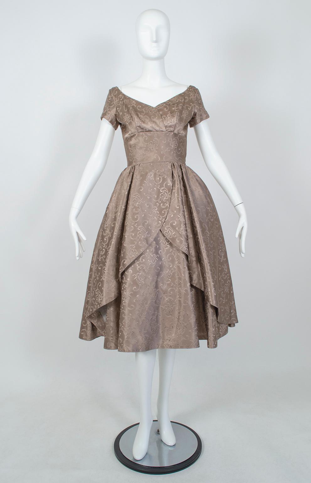 From the estate of a mid-century opera singer comes this New Look party dress, which looks like it might have stepped out of a Henry Clarke fashion shoot. High fashion touches like a cummerbund waist and cutaway skirt are complemented by thoughtful