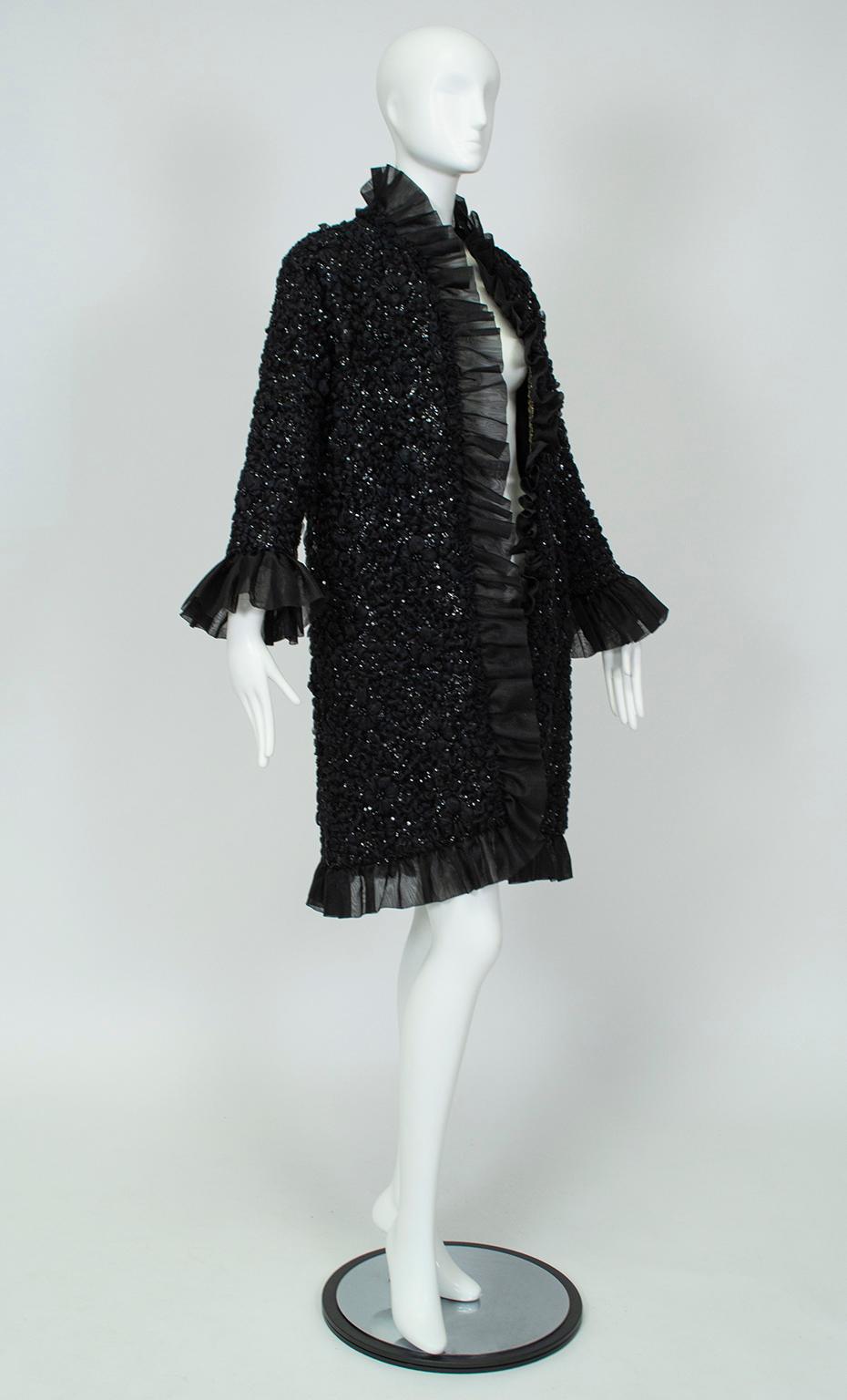 Though it looks lightweight, this clutch coat's knit base provides just enough warmth to keep you comfortable on black tie evenings, but offers a glamorous sparkle that won't spoil the outfit underneath. For a decidedly Fashion Week twist, wear it