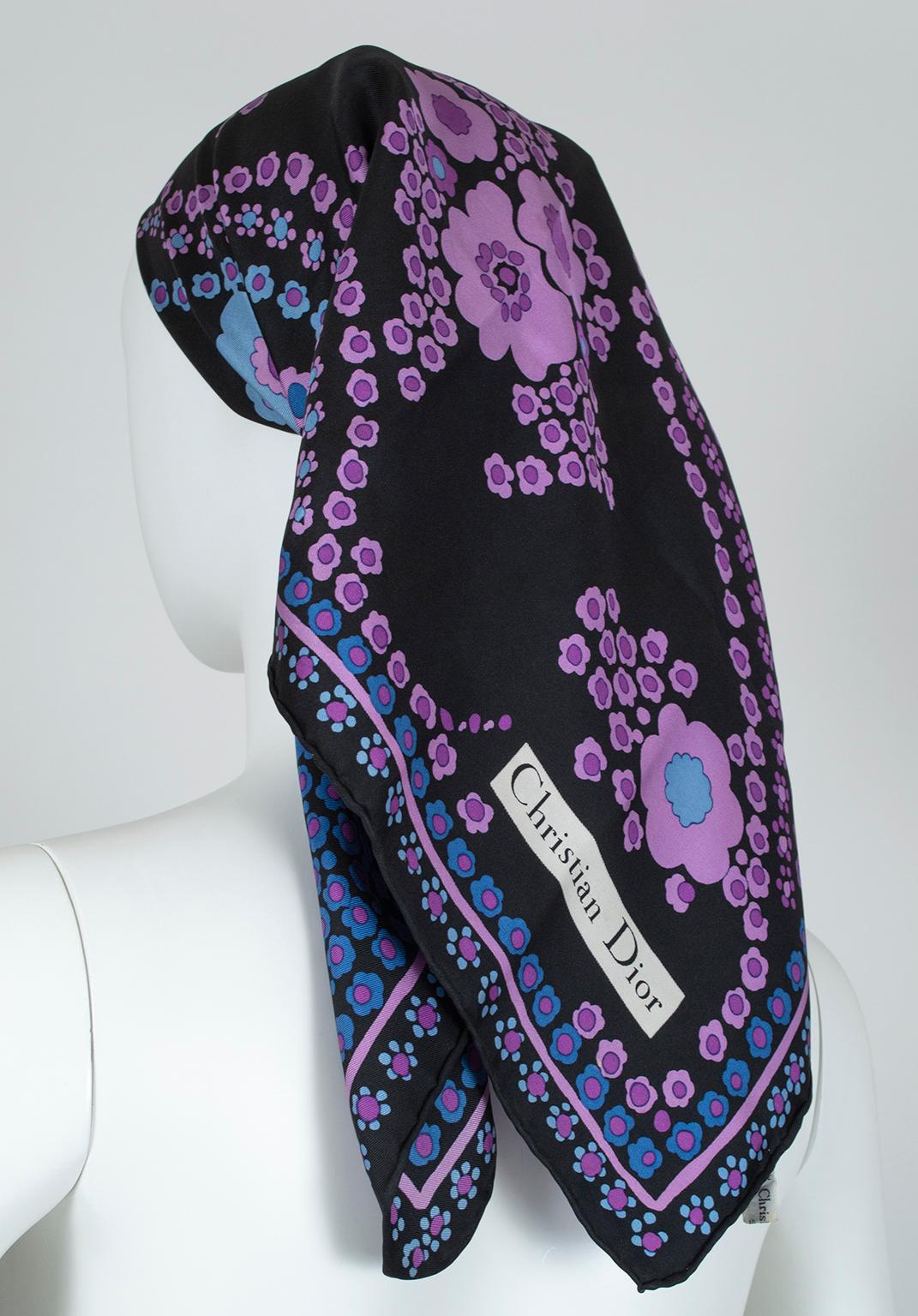 Saturated tones of purple, blue and black embellish this oversized square scarf, large enough to wear around the shoulders, in the hair or on your handbag. Pretty enough to frame!

Single-ply silk twill scarf with rolled edges. Square format