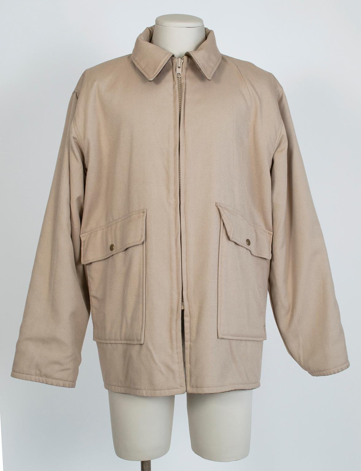 From the estate of an avid hunter and fly fisherman, this reversible field jacket is the real thing, complete with flap pockets for tackle, handwarmer pockets for warmth and a zippered through-pocket in the back for your catch. Luxuriously heavy and