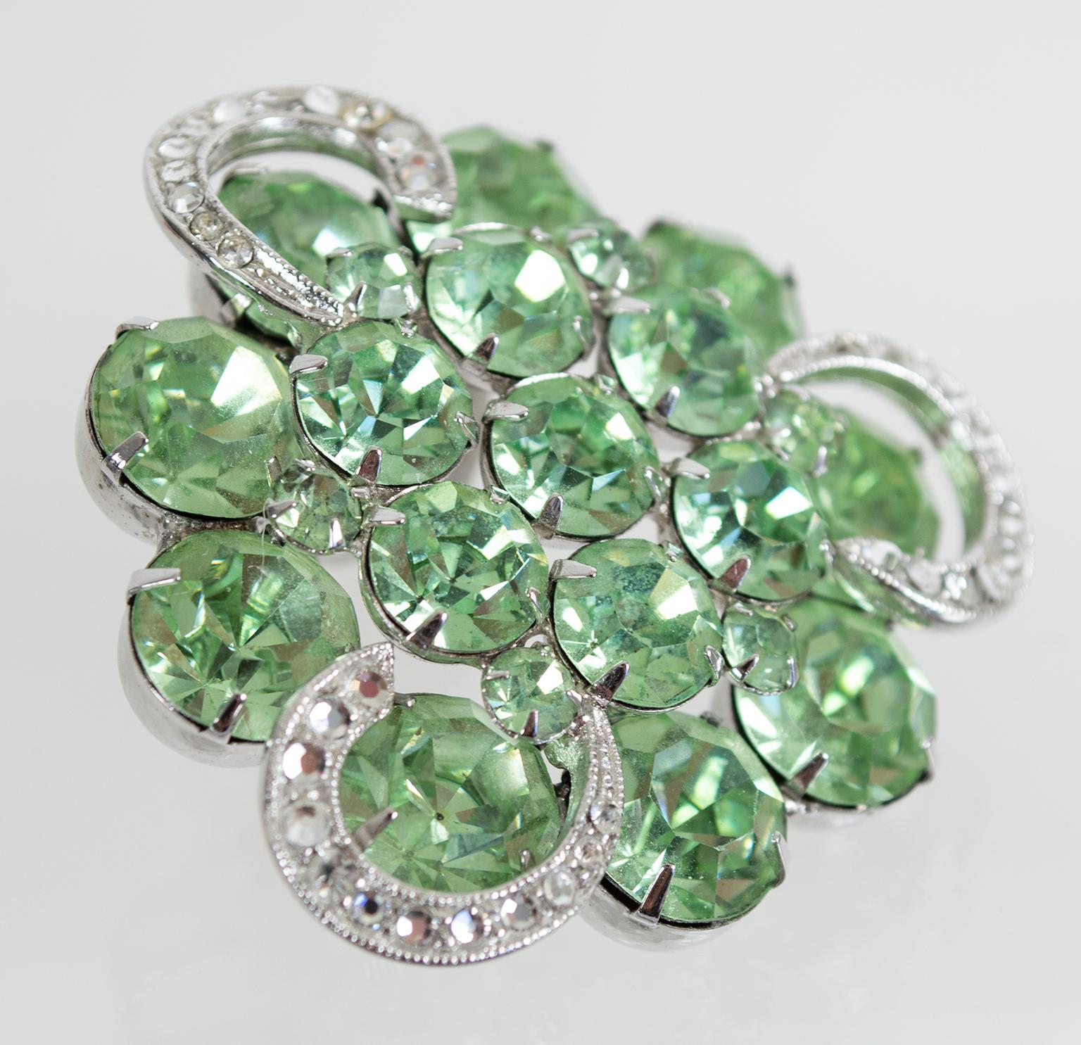 If luck has been less than a lady lately, perhaps it's time for a little encouragement. With 16 massive green crystals this brooch has enough dazzle to get Lady Luck's attention, and its three pavé horseshoes will seal the deal.

Rounded triangle