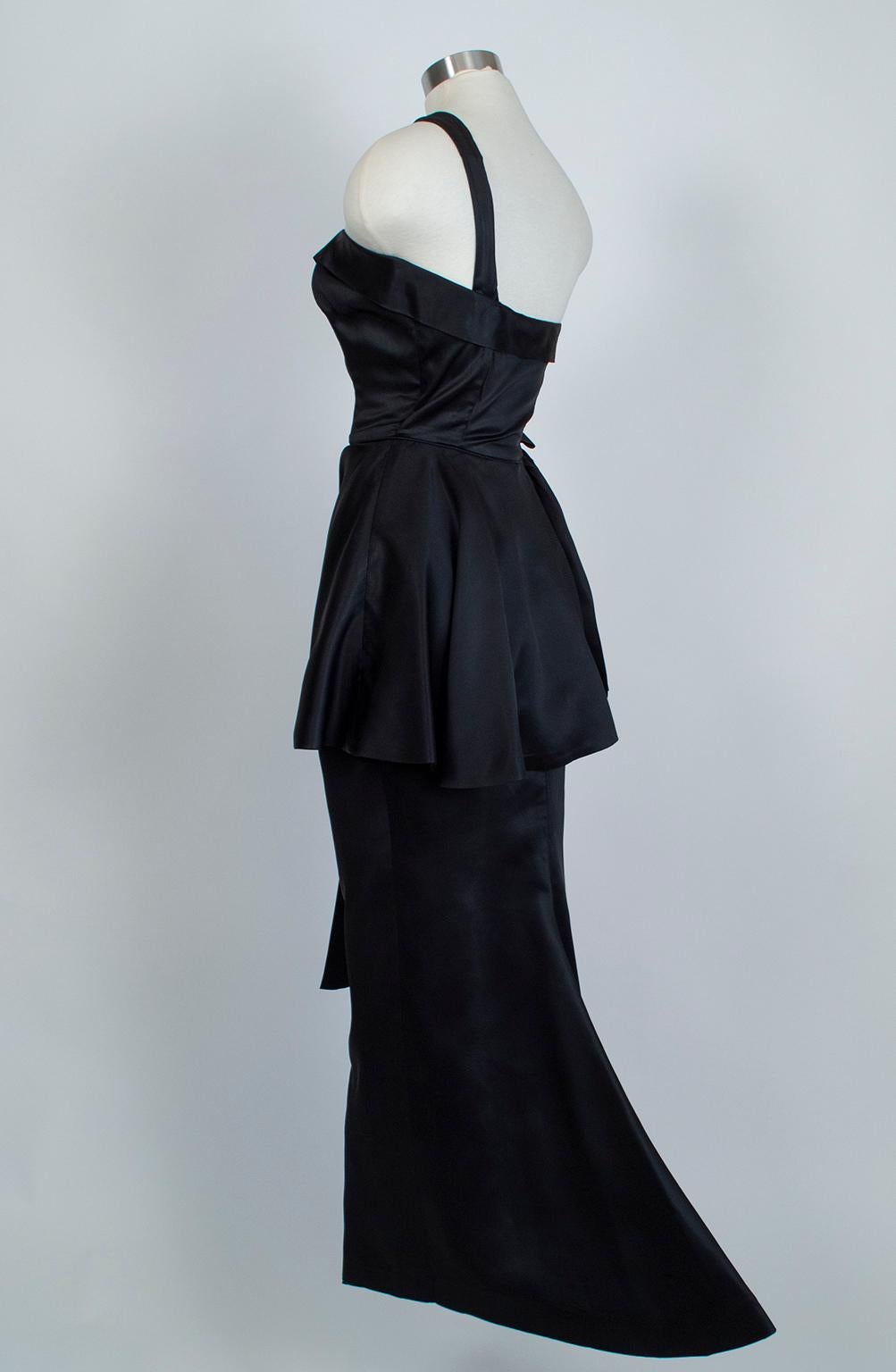A Balmain-inspired frock to take your breath away! Perfectly balanced, this gown combines modern asymmetry, a classic hourglass shape and dramatic midsection details to create an unforgettable black tie garment. An heirloom piece you will seek out
