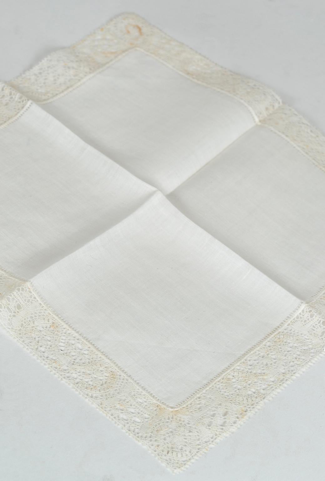 An affectionate memory of a bygone era, vintage handkerchiefs make heartfelt gifts appropriate for almost any occasion. This never-used example features a border of delicate handmade Belgian lace and remains as perfect as it was almost 70 years