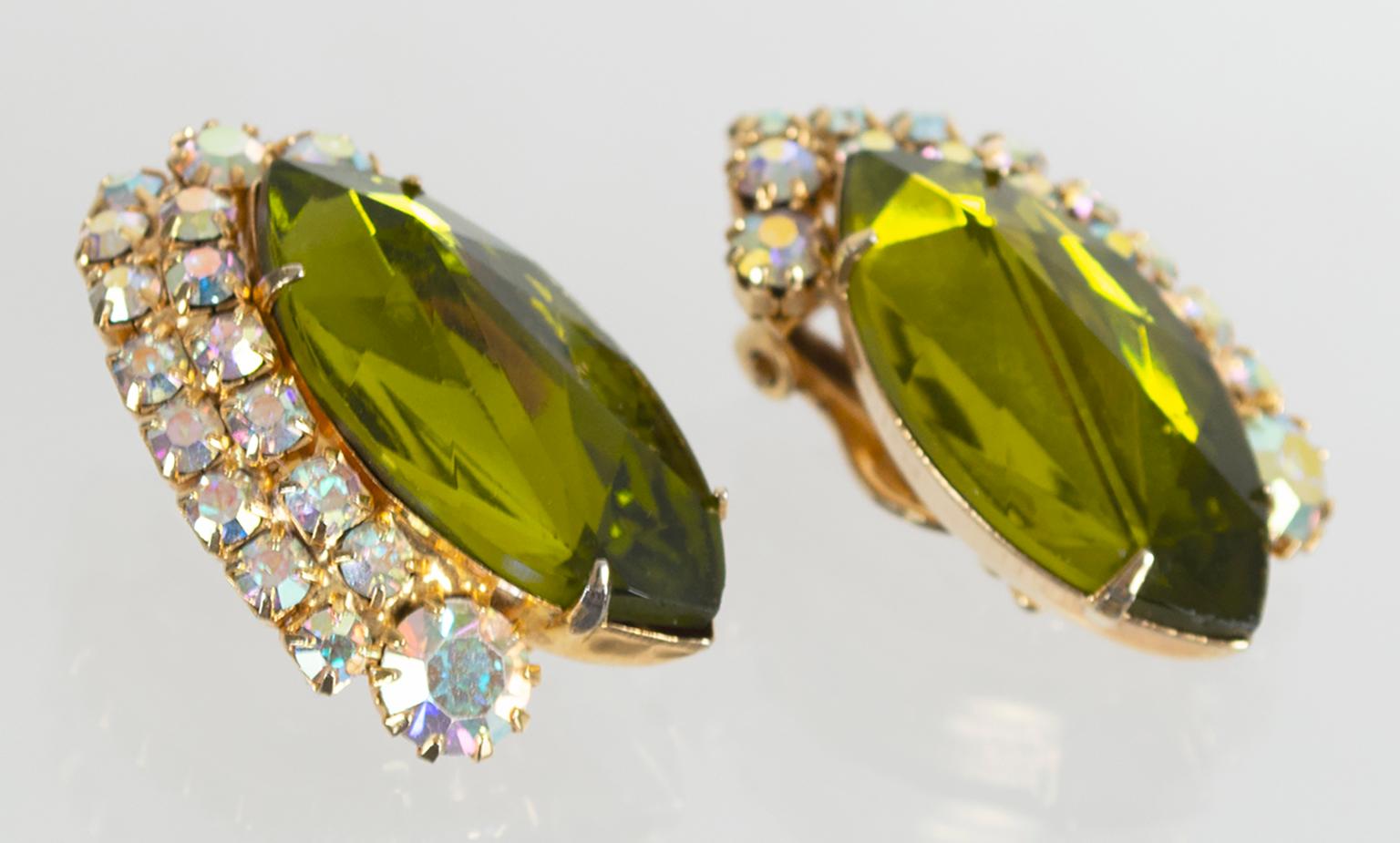 Their large size affords these mesmerizing earrings more facets than typical marquis cuts, giving them a fiery brilliance that perfectly compliments their unique olive tourmaline shade. Though they are costume, their exquisite cut and color make