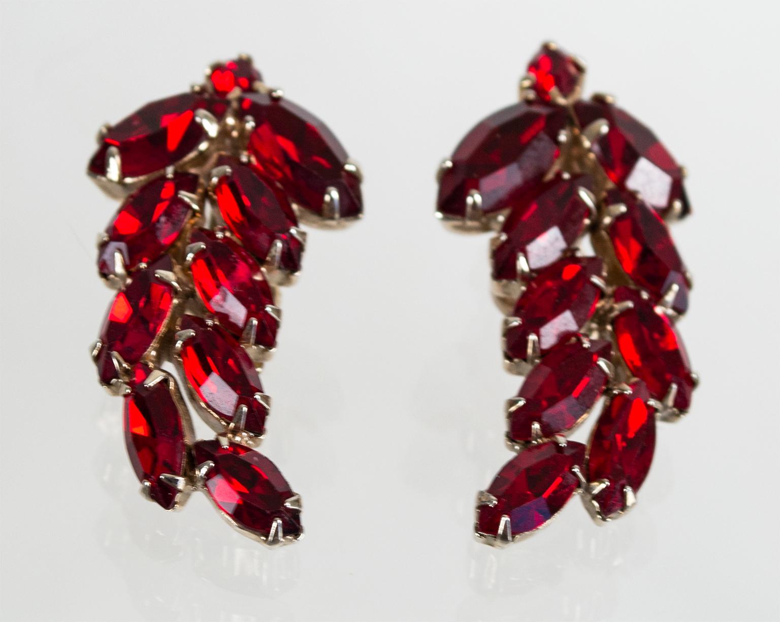 These marquis-cut crystal earrings feature a feminine vine shape so they appear to grow up the outside of the ear when worn. Their deep blood red color is a near perfect facsimile of genuine ruby, so only you will know the difference.

Curved ear