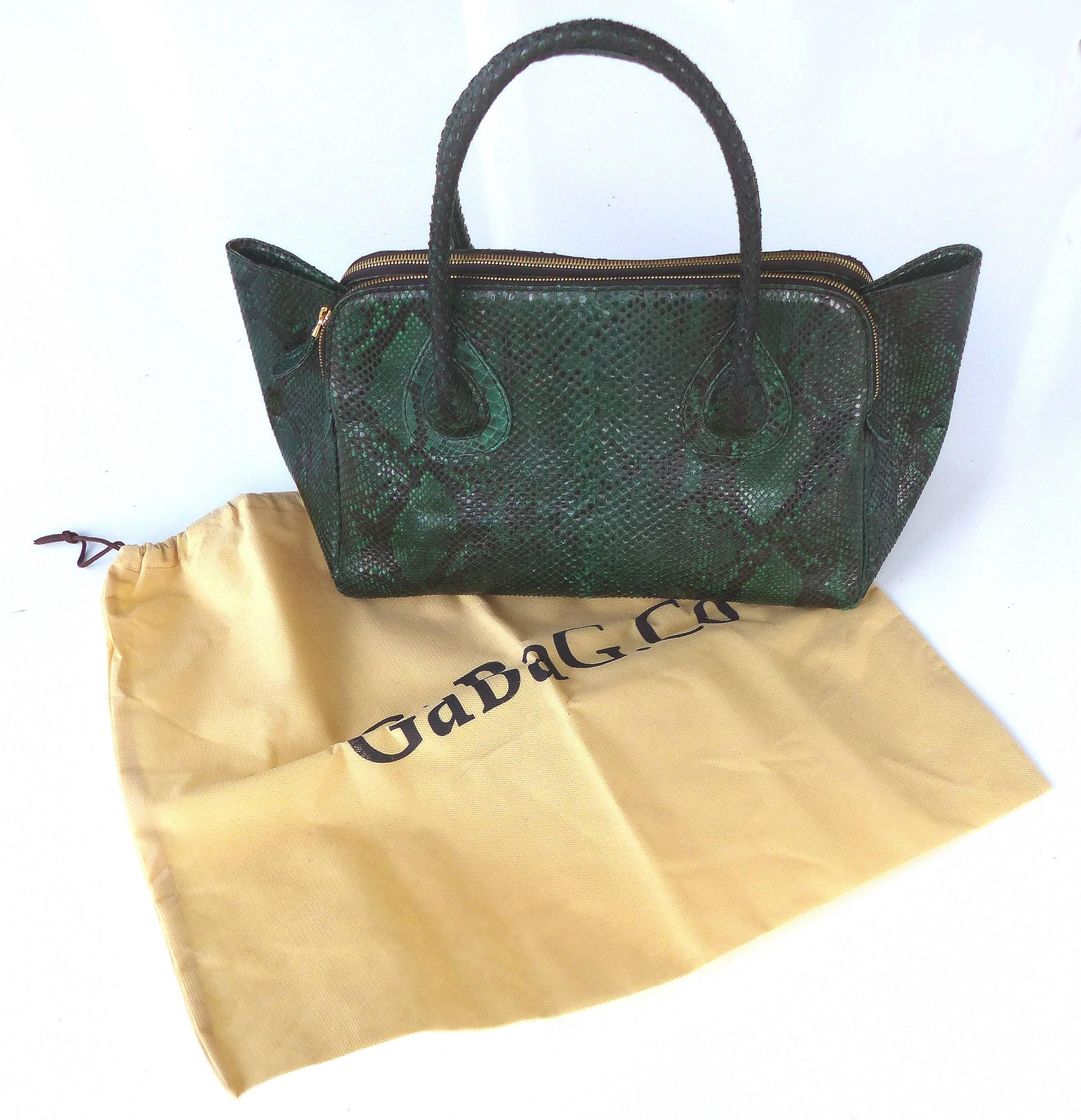

Offered for sale is the large size of the "It" Bag in variegated emerald green python by Glen Arthur Designs for GaBag Co. This wonderful bag is has three interior compartments. The side interior compartments have high quality brass