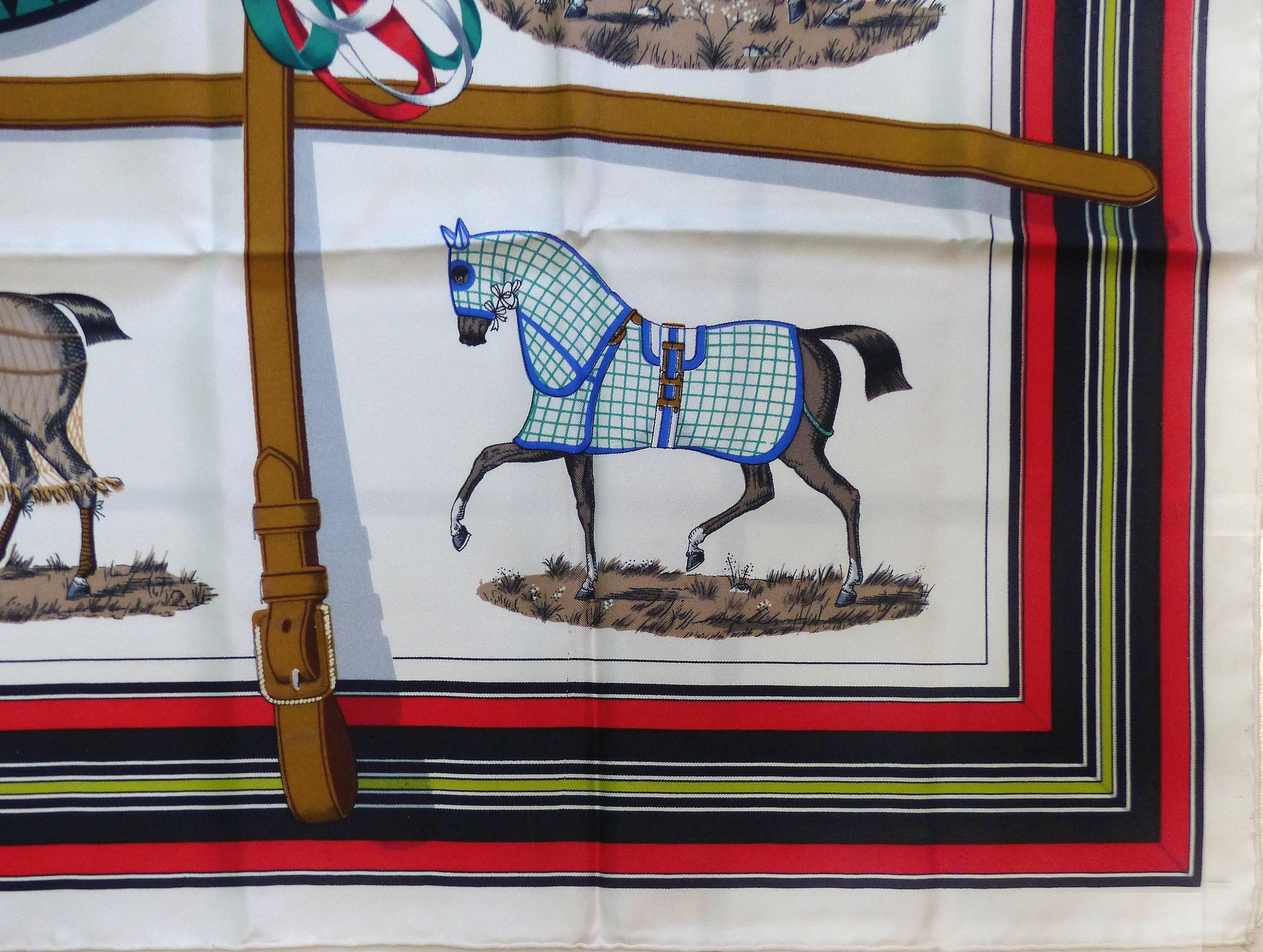 Offered for sale is a vintage horse motif silk hermes scarf titled "Couvertures et Tenues de Jour". This scarf was originally designed in 1962 By Jacques Eudel  and has been reissued since with different center emblem variations. This is