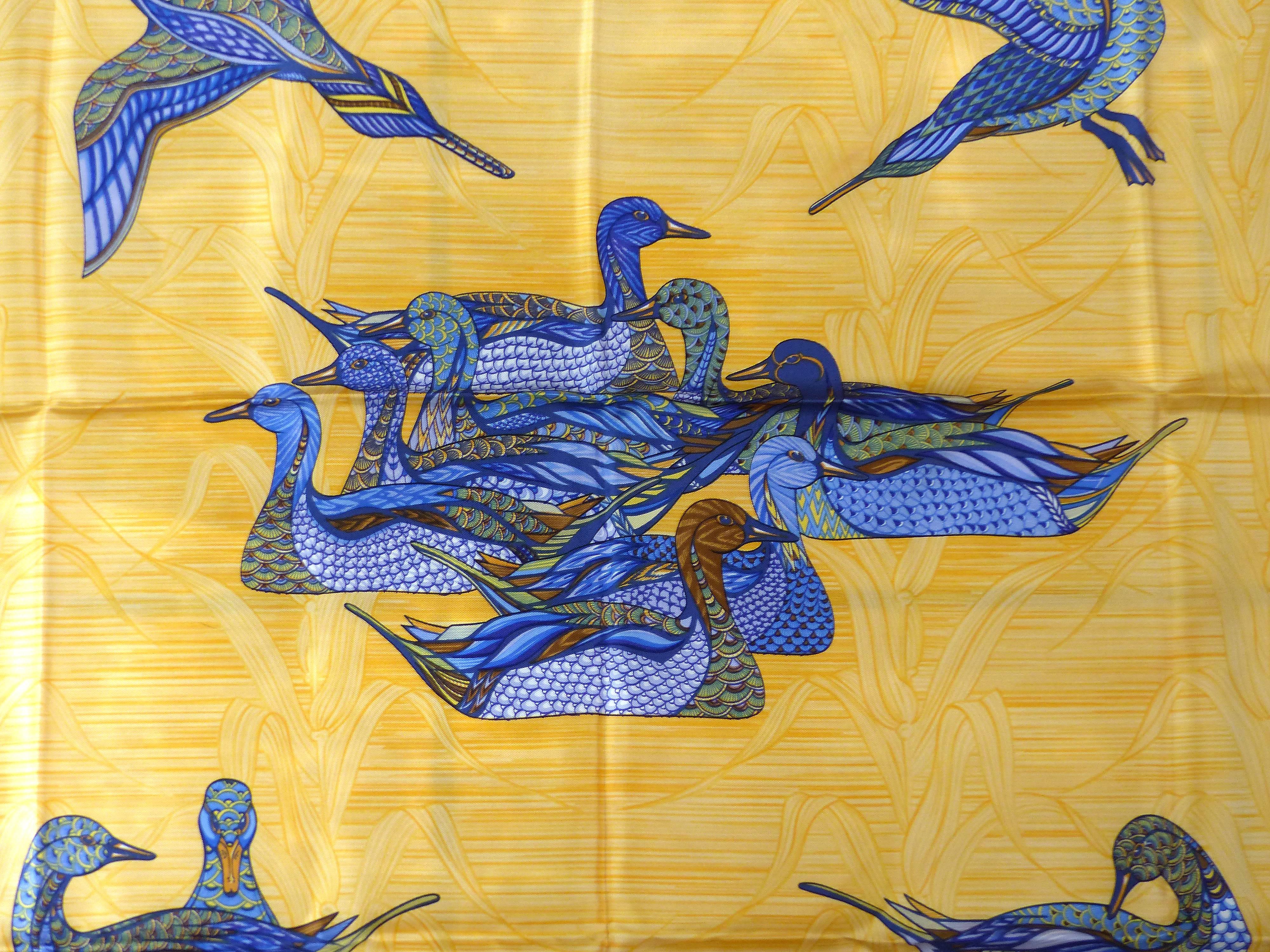 Offered for sale is an Hermes silk scarf titled "La Mare aux Canards" by Daphne Duchesne in 1981. This scarf depicts ducks gliding across waters. The scarf was acquired from a collector and still retains the original folds.