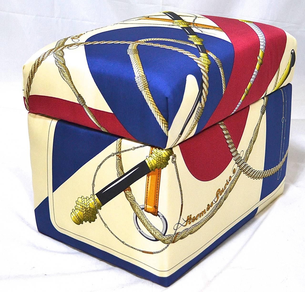 Guaranteed authentic HERMES Pre-owned Vintage silk scarf incorporated into a Newly Fabricated Kiri-Box by Rita-Mari Couture. 
    Shades of purple, yellow, white, and green.  Stitched edging.


BOX MEASURES: L 14