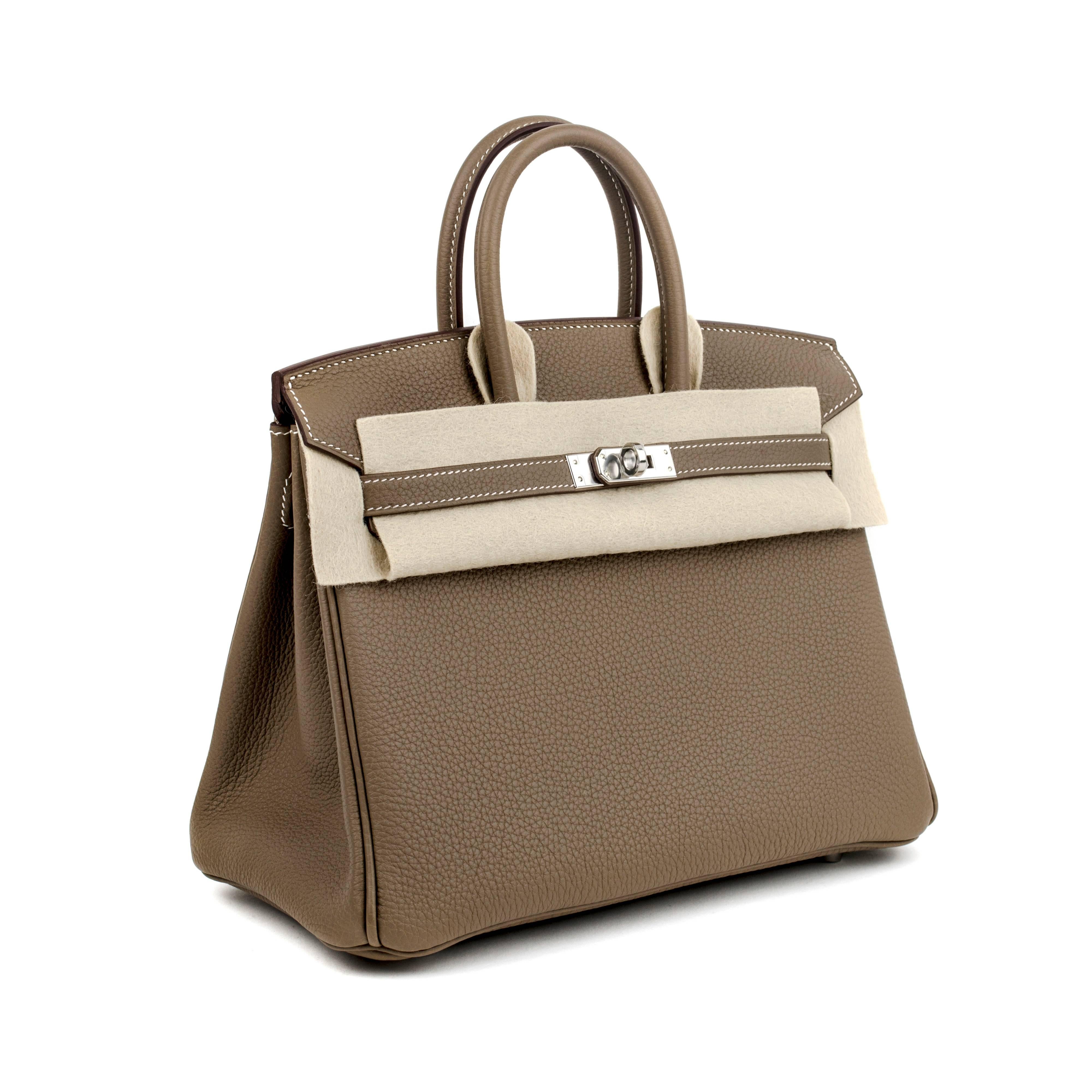 Brand New, fresh from store and never worn Hermes Birkin purse, 25 cm in chick and elegant classic Etoupe (Grey) color and classic calfskin Togo leather. This nice piece has Palladium Hardware (PHW). The Birkin handbag has been just picked up at
