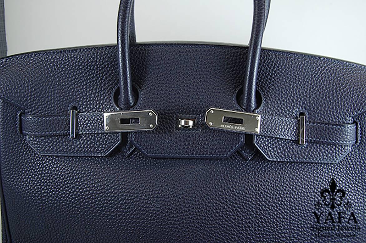 35cm Navy Blue Birkin Bag with Silver Hardware, Hermes
100% Authentic Hermes Birkin Bag
COLOR: Navy Blue 
MATERIAL: Leather
HARDWARE: Silver
ORIGIN: France
CONDITION: Excellent
INCLUDES: Dustbag, lock, and key