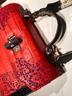 Crocodile Handle Bag in Red with Blue Laser Cuttings on Side