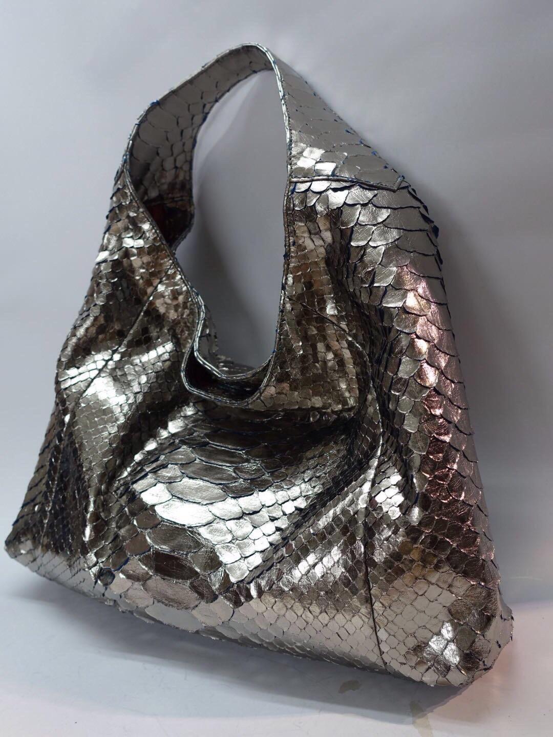 Big gun silver metallic python bag is best particular and casual long lasting stylish of Ana designs! Suede lining trim with python. It’s very light, soft, waterproof and durable!