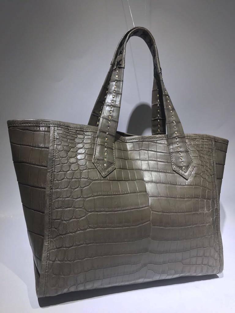 Ana Switzerland Crocodile Handbags all exquisite original design crafted by hand and made with finest skins. Each bag with colorful suede lining and with Swarovski crystals. We have in different colors: Black, Blue, Gray, Green. 
