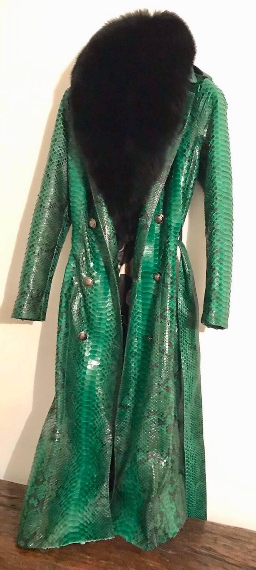 Ana Switzerland new Brand Green Python long coat to knees, Medium size with detachable Fox collar, two split at the back and military gun metal buttons. Can order Black, Grey, Natural Black White, baby pink, Emerald green and Blue colors.