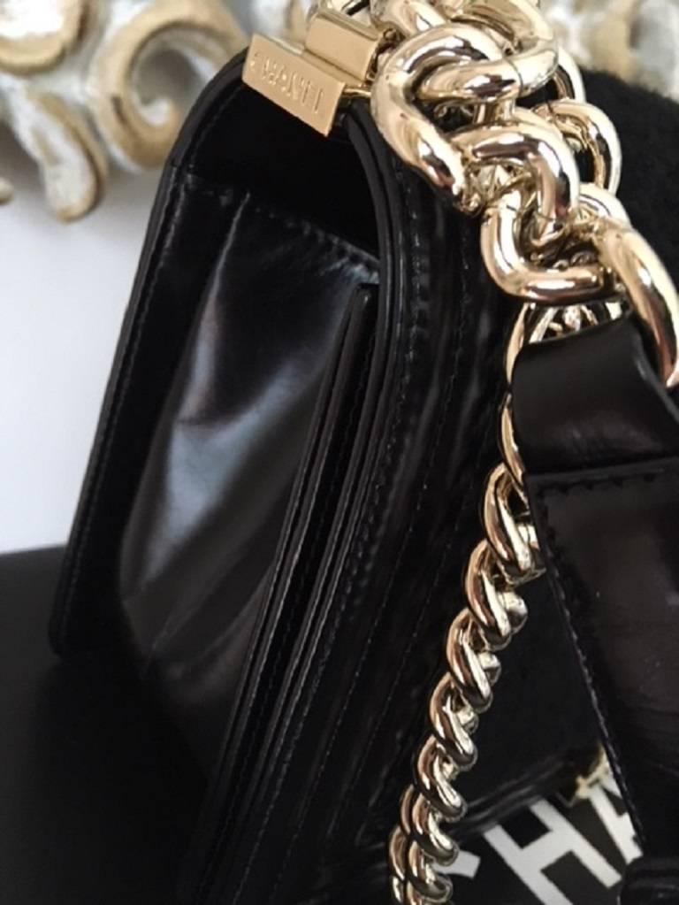   STORE FRESH .

Stunning Chanel medium Boy bag with gold metal hardware. BRAND NEW . 
This exquisite beauty features black Shearling Sheepskin on soft supple 
lambskin leather. The bag has 1 internal pocket . On the outside is the CHANEL CC 
lock