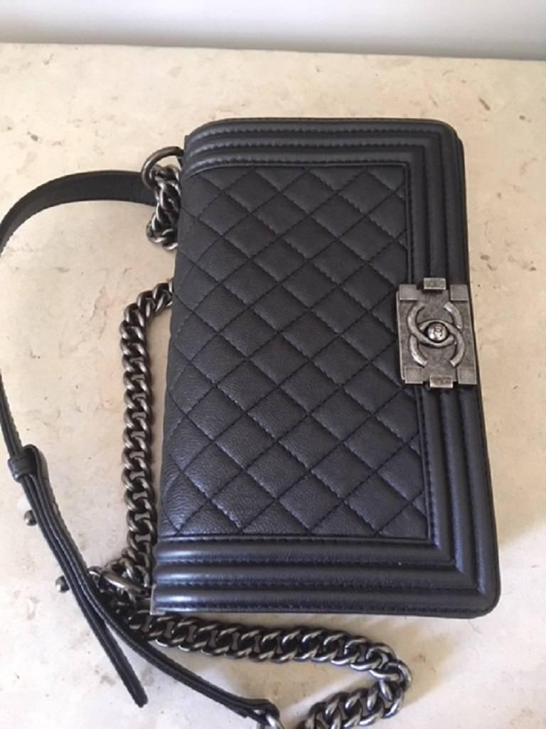 This medium CHANEL boy bag features the quilted goatskin leather . The bag is brand new .
Perfect size for an every day or evening bag. It holds an internal open pocket . On the outside the bag has the Chanel CC lock closure. The silver tone chain