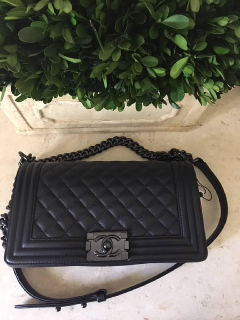 Black Chanel Medium SO black Boy Bag in quilted Caviar Leather .