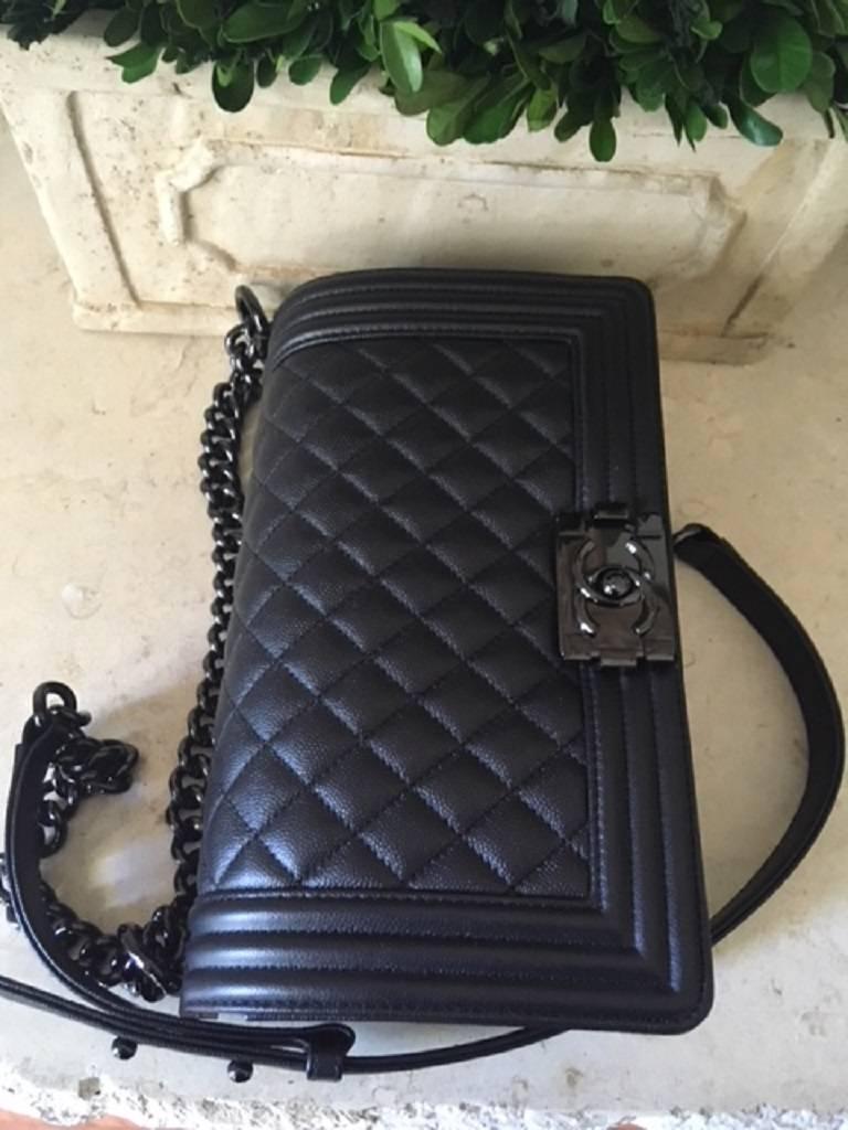 Women's Chanel Medium SO black Boy Bag in quilted Caviar Leather .