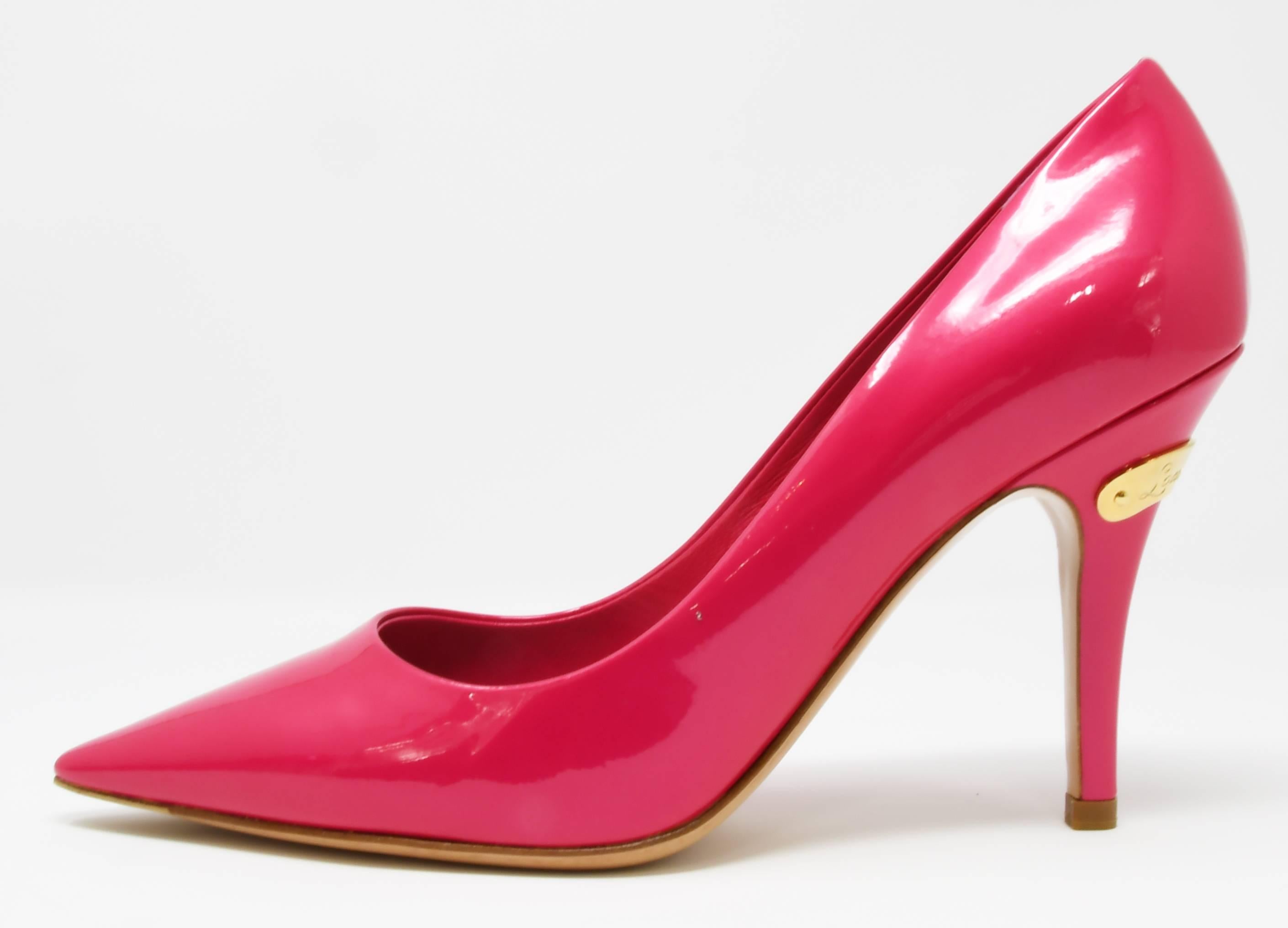 Classic stiletto silhouette in a vibrant fuchsia patent leather.  Gold Louis Vuitton logo on the heel.  Great heel for both day and night.  Never been worn.