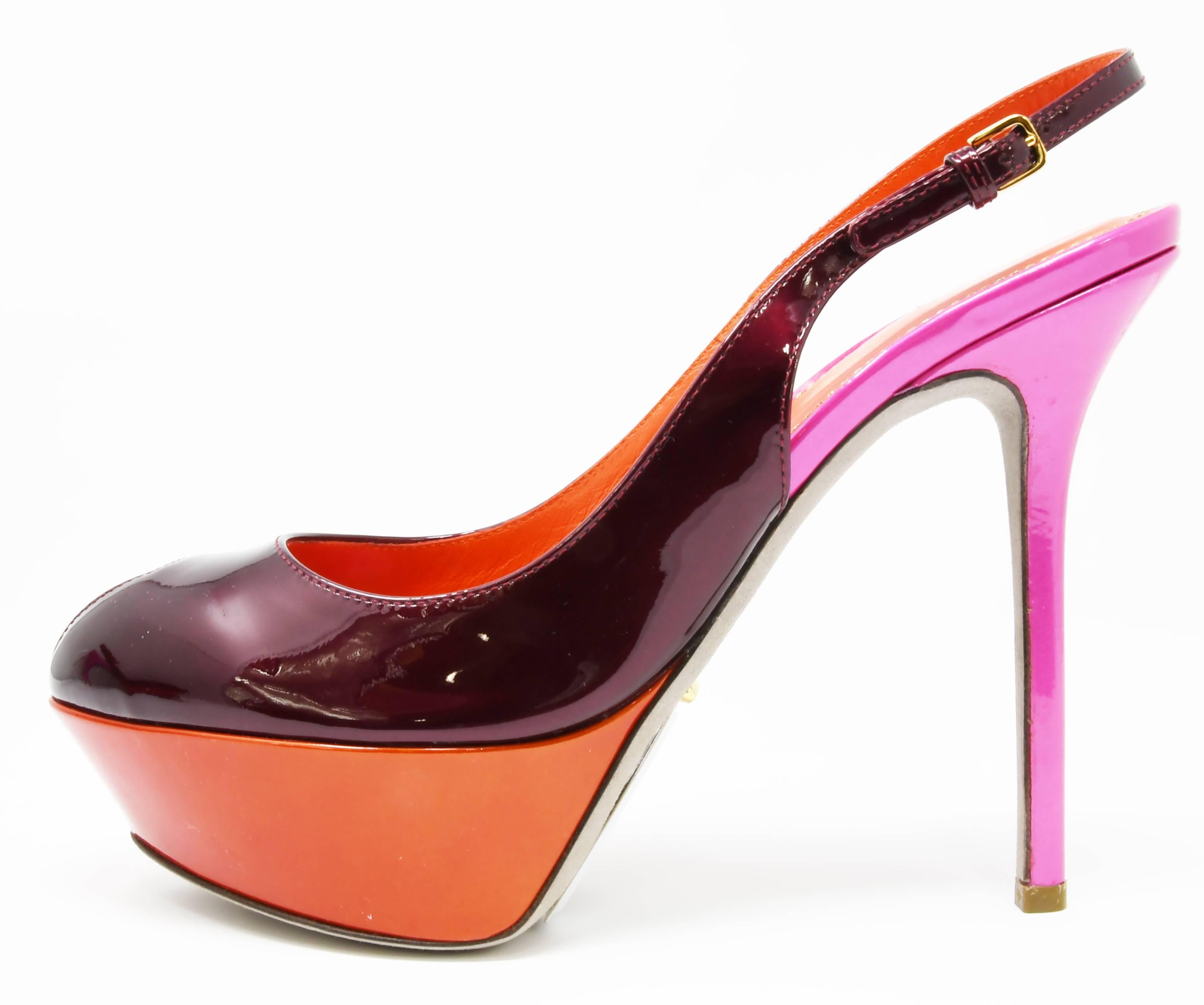A gorgeous Sergio Rossi statement piece in color block.  Multi colored orange, fuchsia and burgundy platform heels.  Sling back with stiletto heel.  Never been worn. Size 36