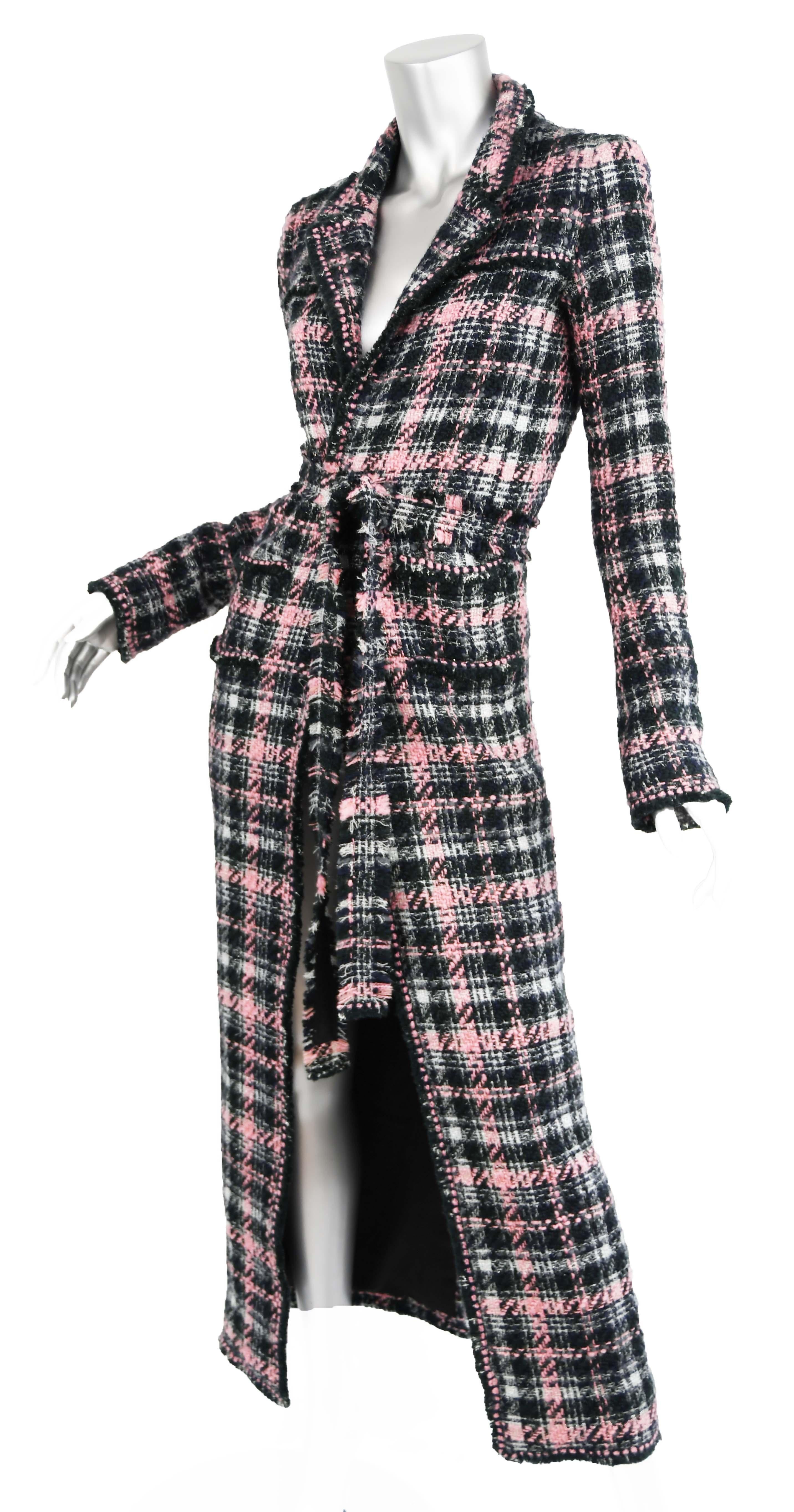 Stunning and classic long Chanel tweed coat in pink, green, black and silver.  Chanel logo buttons with a bow detail.  Coat comes with matching belt and features a peak lapel collar.

Size:  Missing size tag but approximate FR 34/36

Measurements: