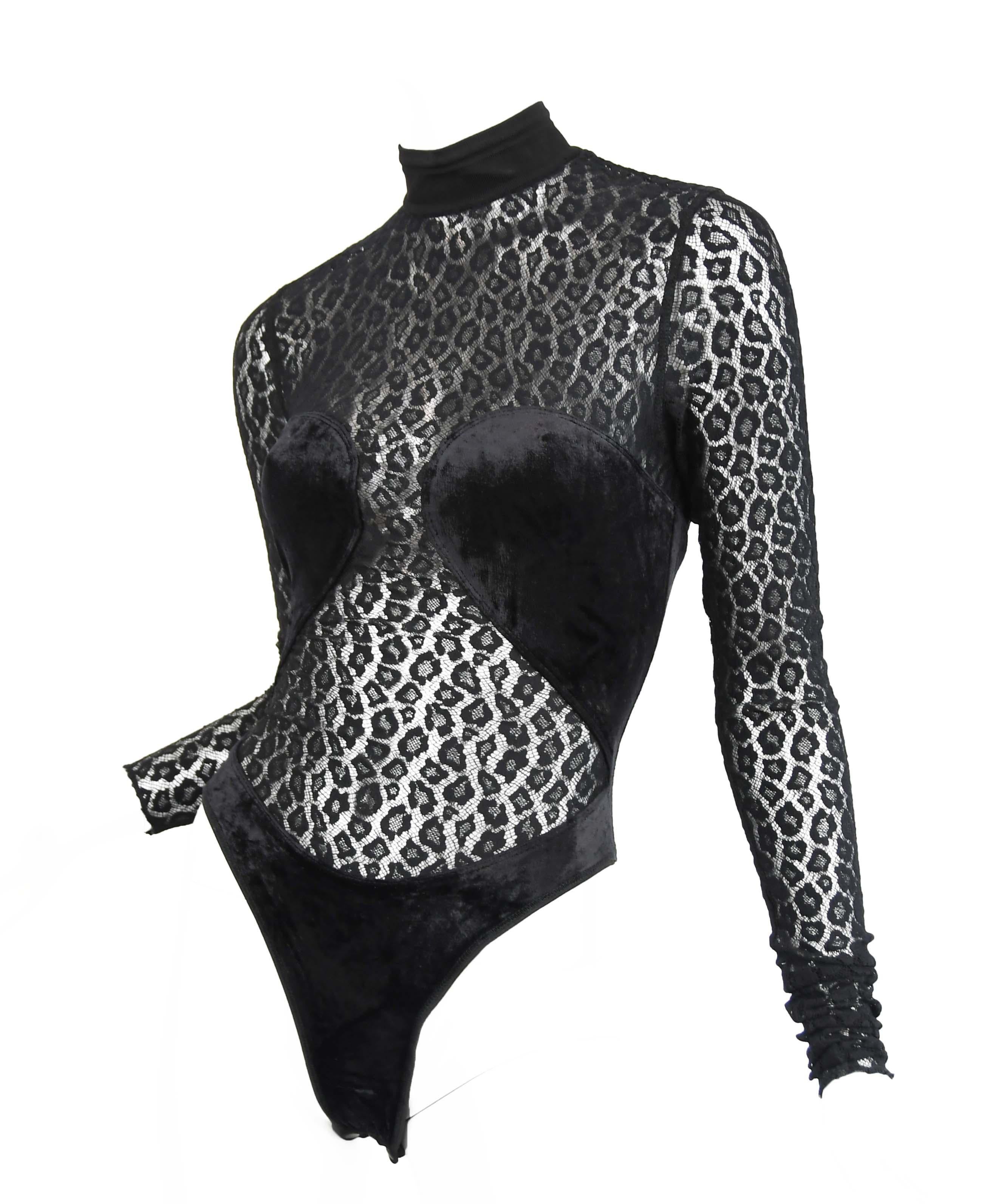 Rare vintage 1991 Alaia bodysuit, a coveted collectors item.  Do not miss out of the opportunity to own this sexy stretch leopard lace and velvet bodysuit with a high neckline.  Invisible zipper down center back.

Condition: Pristine vintage