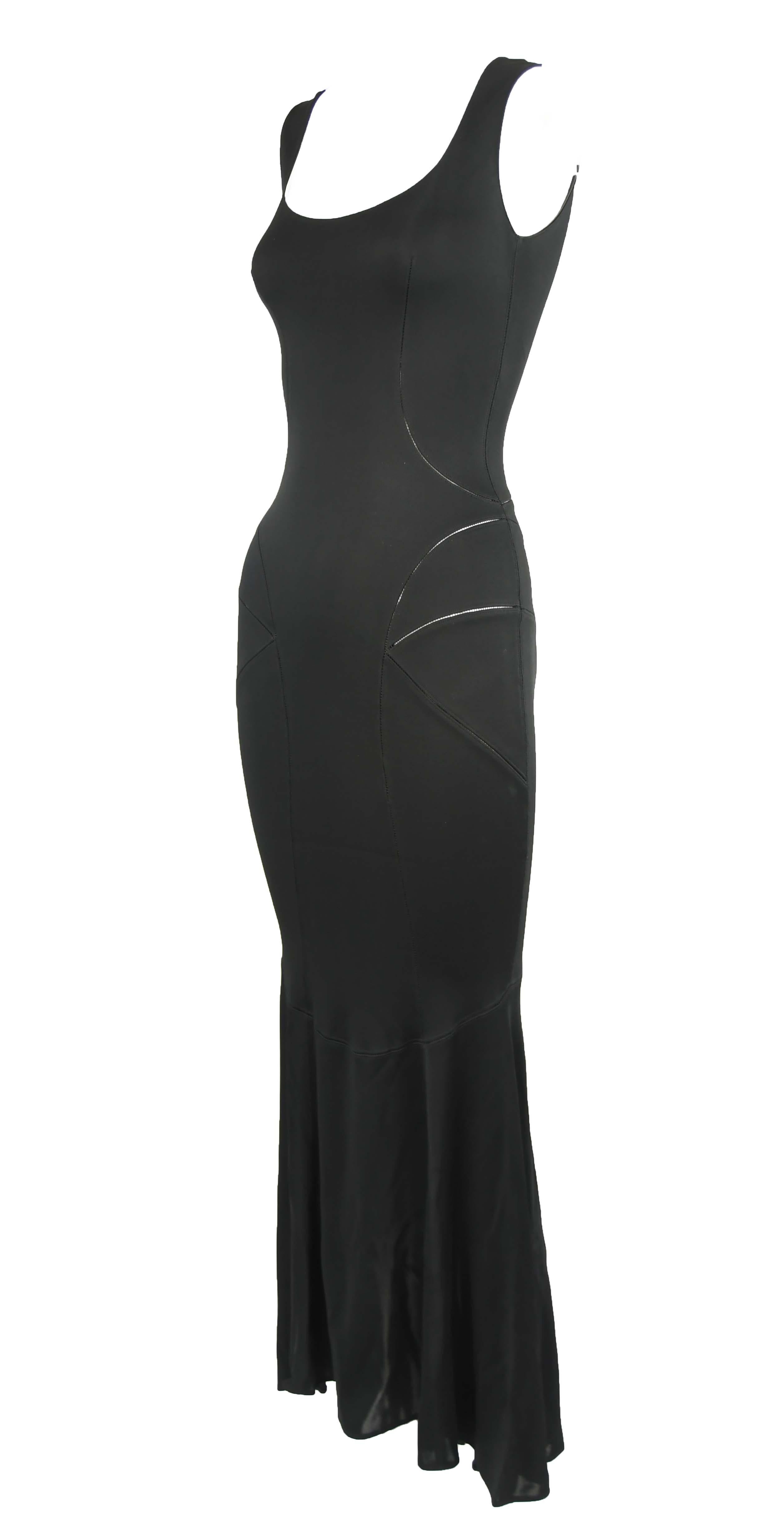 Vintage Alaia sleeveless black tea length gown.  Stunning seams that show a slight bit of skin.  Makes for the perfect wardrobe essential.

Size: S

Condition: Pristine vintage condition

Composition: 100% viscose

Care: Dry clean only

Made in Italy