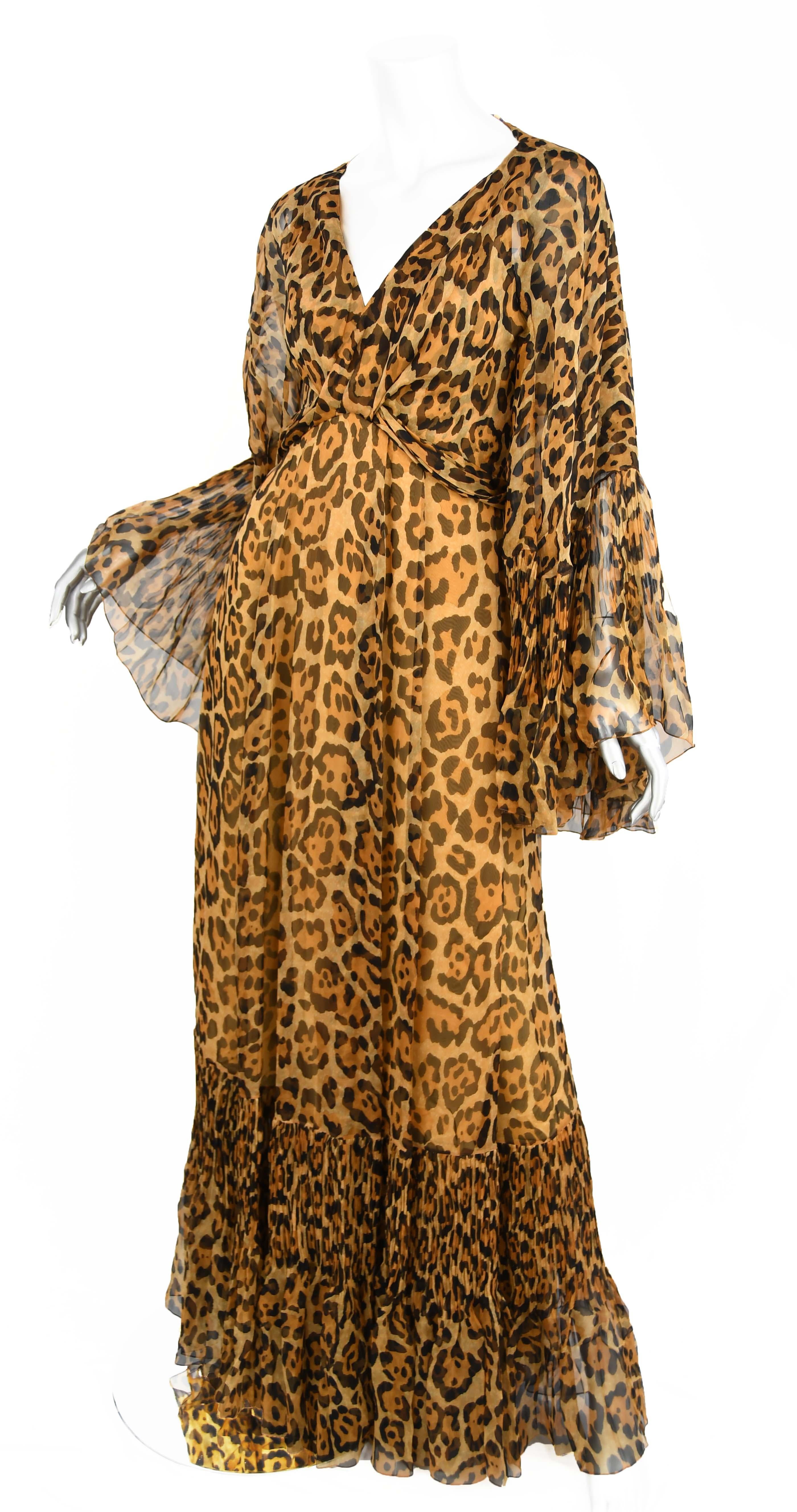 Make a statement in this elegant Christian Dior leopard gown, made of stunning silk chiffon.  Attached cape with pleated ruffles. Beautiful covered button detail down the back.  From Resort '09 collection, Demi Lovato recently wore this to the 2018