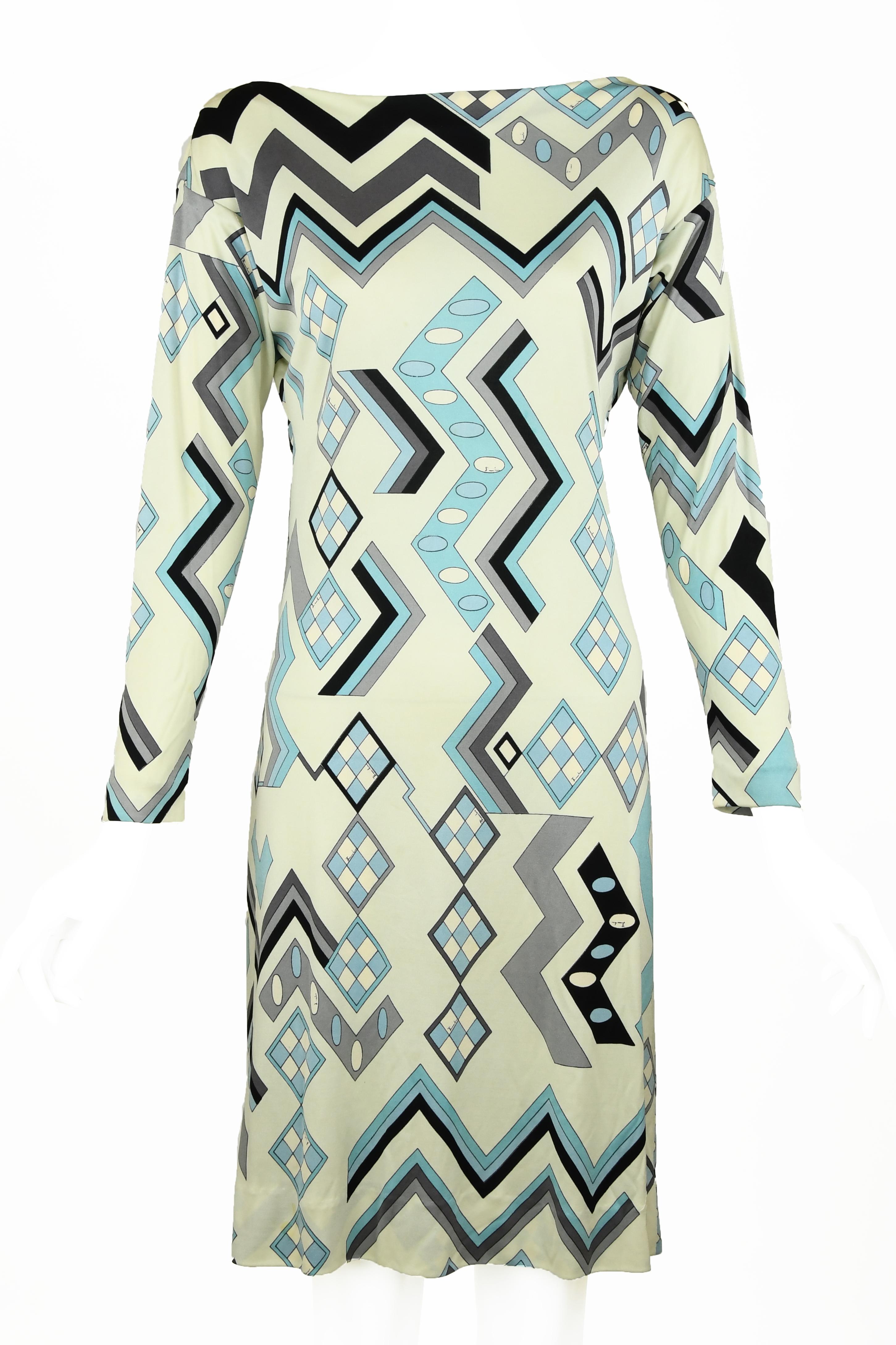 Truly special vintage Pucci dress in soft shades of white, blue and gray.  Features three quarter sleeves and optional belt with delicate and beautiful gold hardware.  This geometrical print is incredible and rare to find such a piece in pristine
