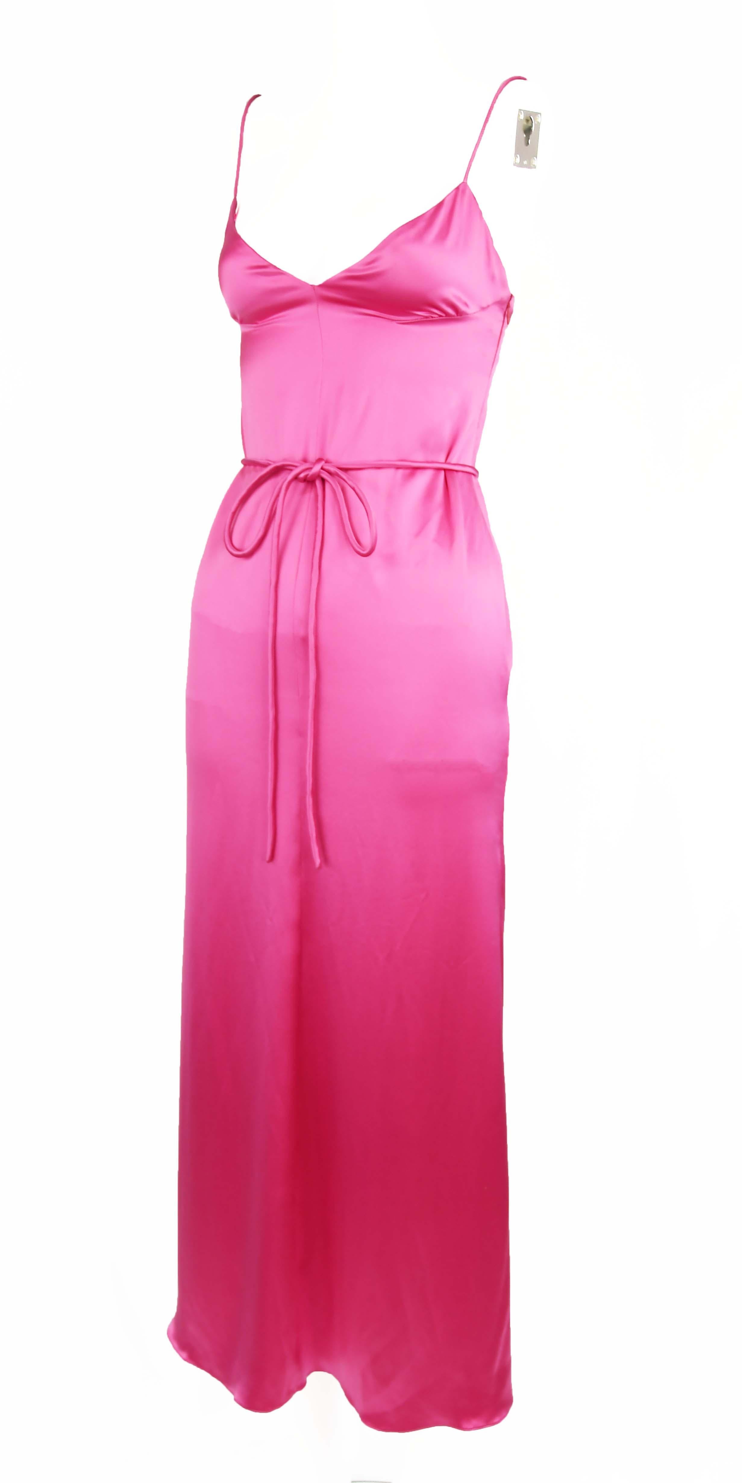 Simple, elegant and stunning, this Valentino pink silk gown is picturesque.  Made of silk charmeuse and features spaghetti straps and tie at the waist.  A Valentino classic.

Size: 4

Condition: Excellent vintage condition

Composition: 100%