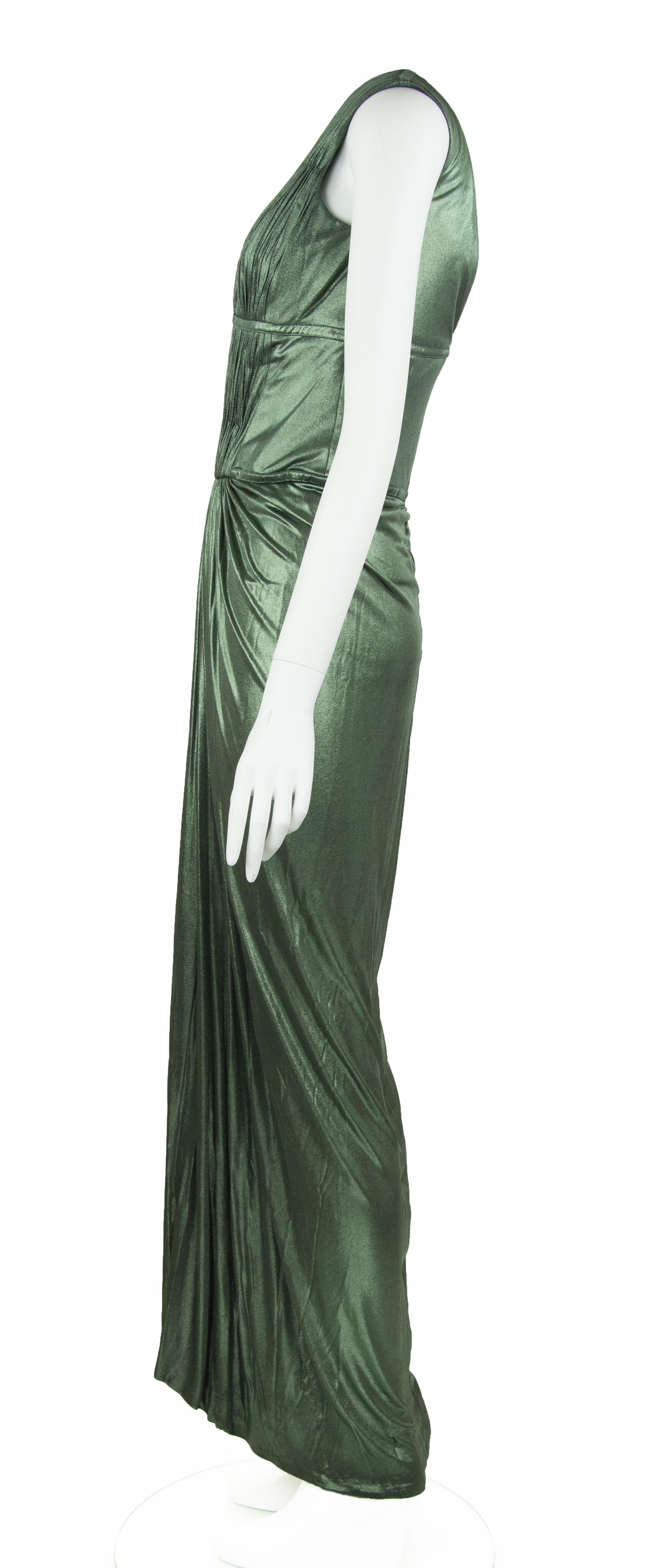 Incredibly sexy, Roberto Cavalli green metallic gown.  Features a very low v neck in the front and back with gathering on the bodice and skirt.  Perfect look for your next black tie event.

Size: IT 40

Condition: Pristine

Composition: 100% cupro /