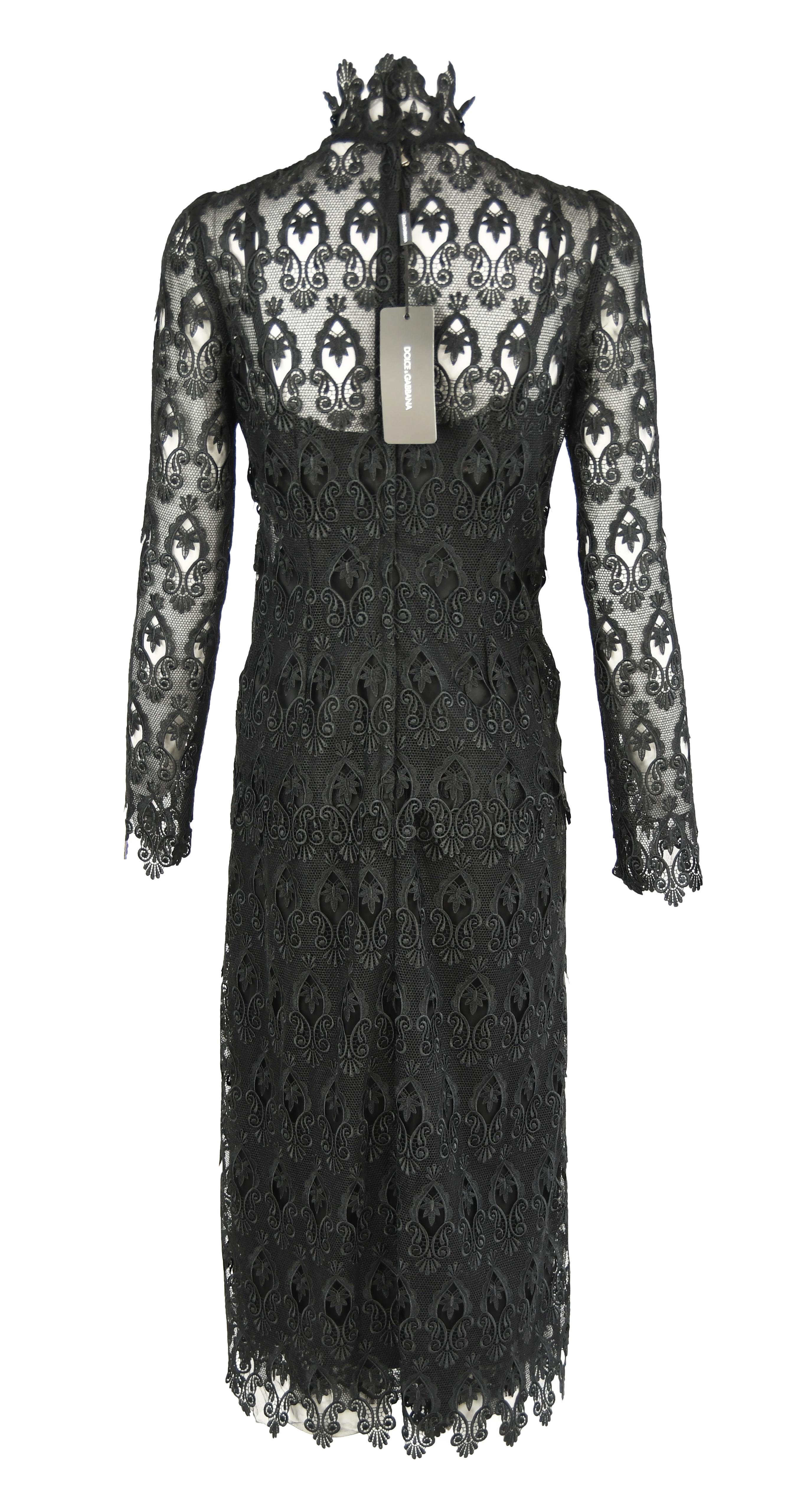 Chic and sophisticated Dolce & Gabbana long sleeve sheath dress.  Elegant high collar.  New with tags.  Perfect for a winter cocktail party or Christmas dinner.

Size: IT 40

Condition: New with tags

Composition: 70% polyester, 30% nylon / (lining)