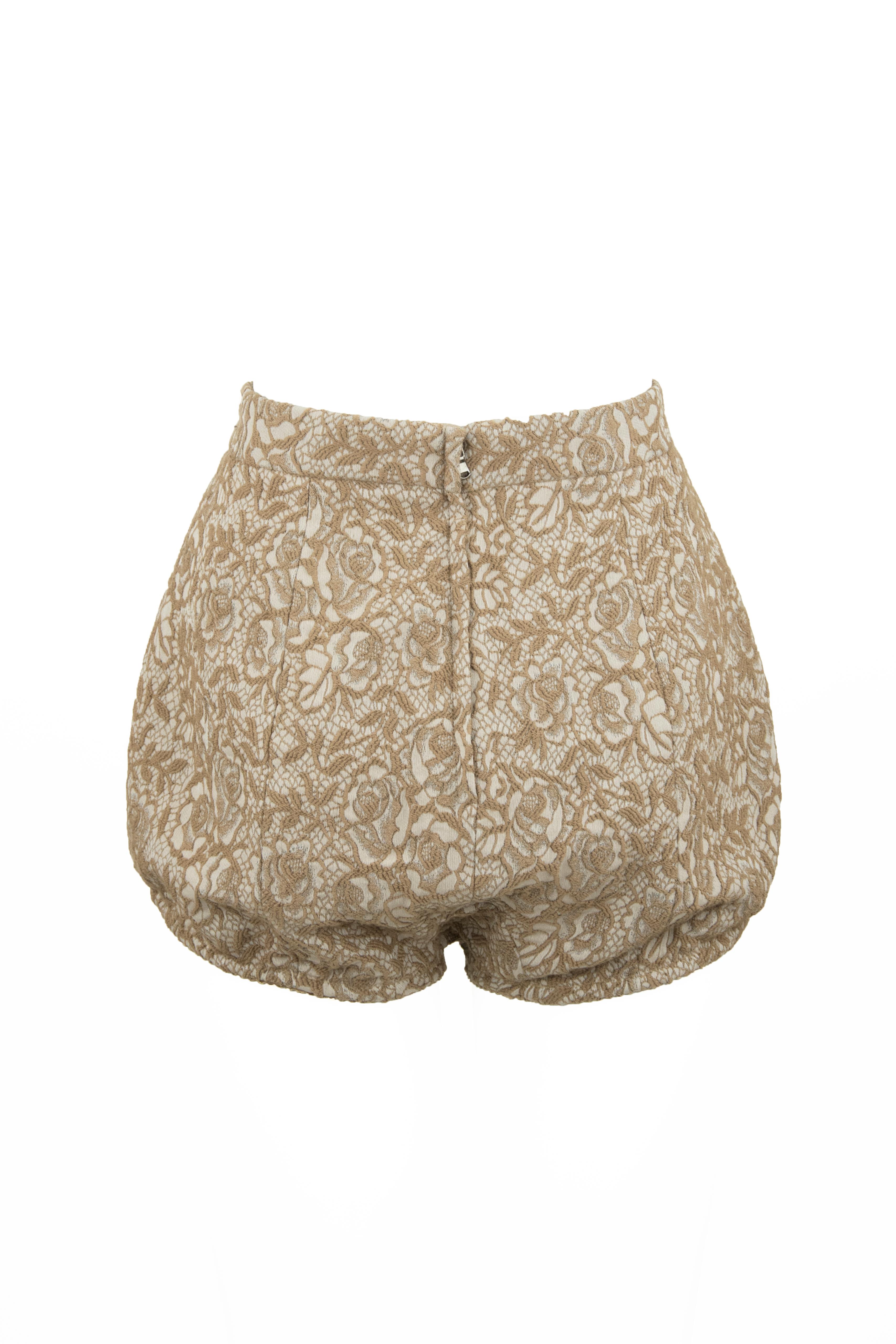 Dolce & Gabbana lace jacquard hot pants that are perfect for a leggy look.  Gorgeous embroidered fabric that creates a lace effect.

Size: IT 40

Condition: Pristine

Made in Italy