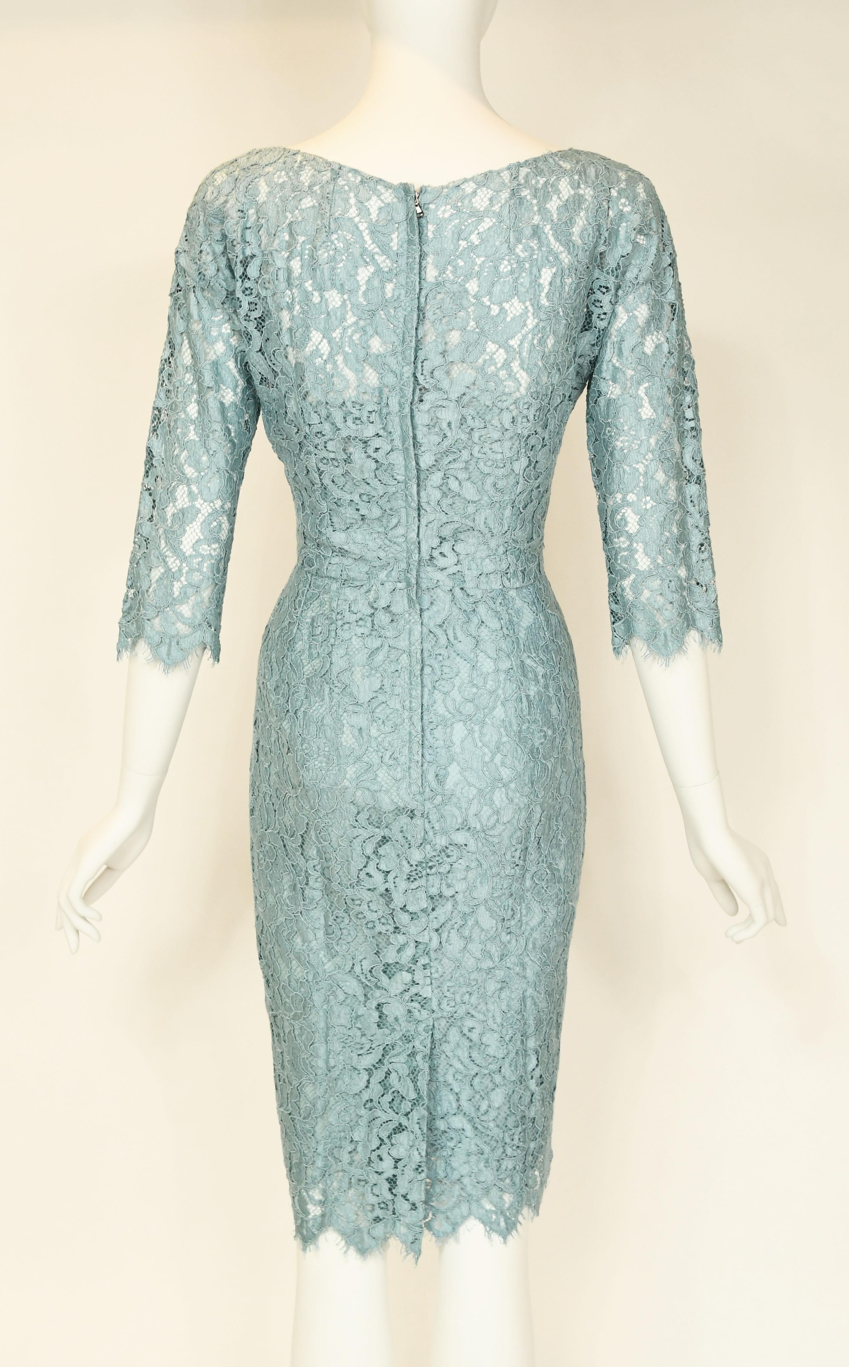 Classic D&G lace sheath dress, perfect for a luncheon over the summer or dinner with friends.  Center back zipper and light blue charmeuse slip under.  New with tags.  Size IT 40.