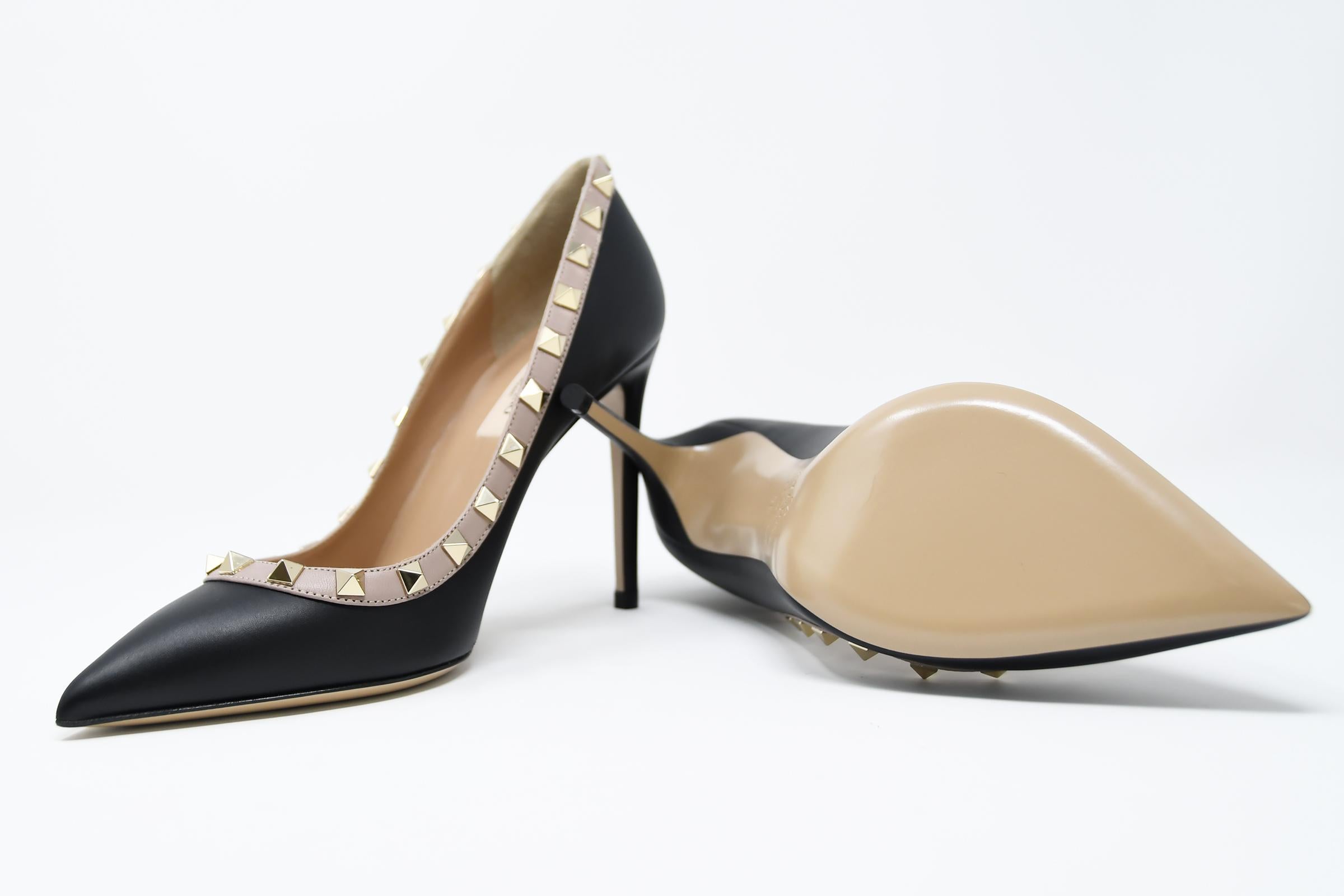 Classic Valentino stiletto in a smooth black calf leather with signature gold rock stud design.  Brand new and comes in original box with dust bag.