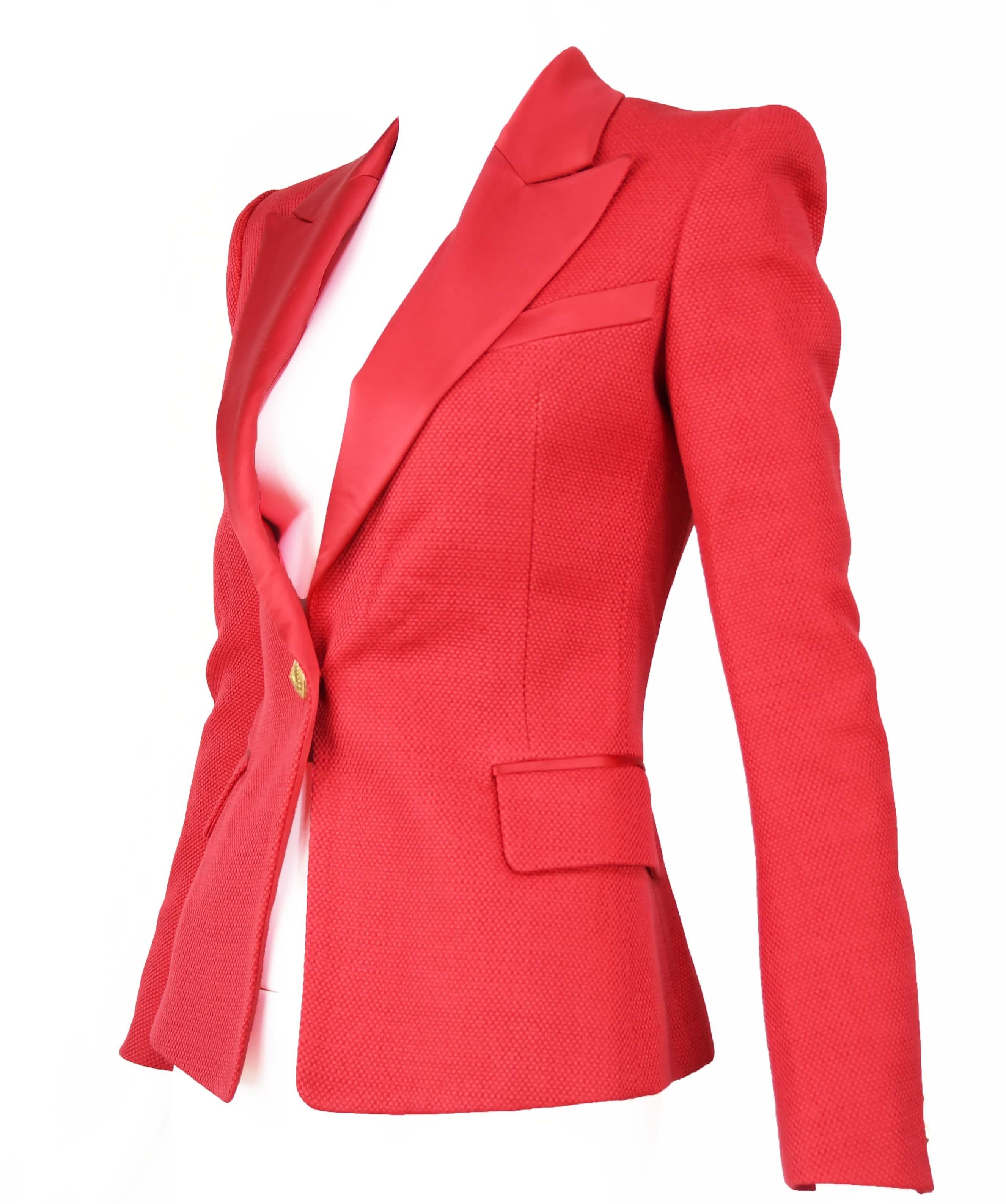 Single breasted bright red Balmain pique blazer with satin collar.  Gold button with Indian head.  Brand new item with original tags.

Condition: Brand new with original tags

Composition: 100% viscose / (collar) 100% silk / (lining) 52% viscose,