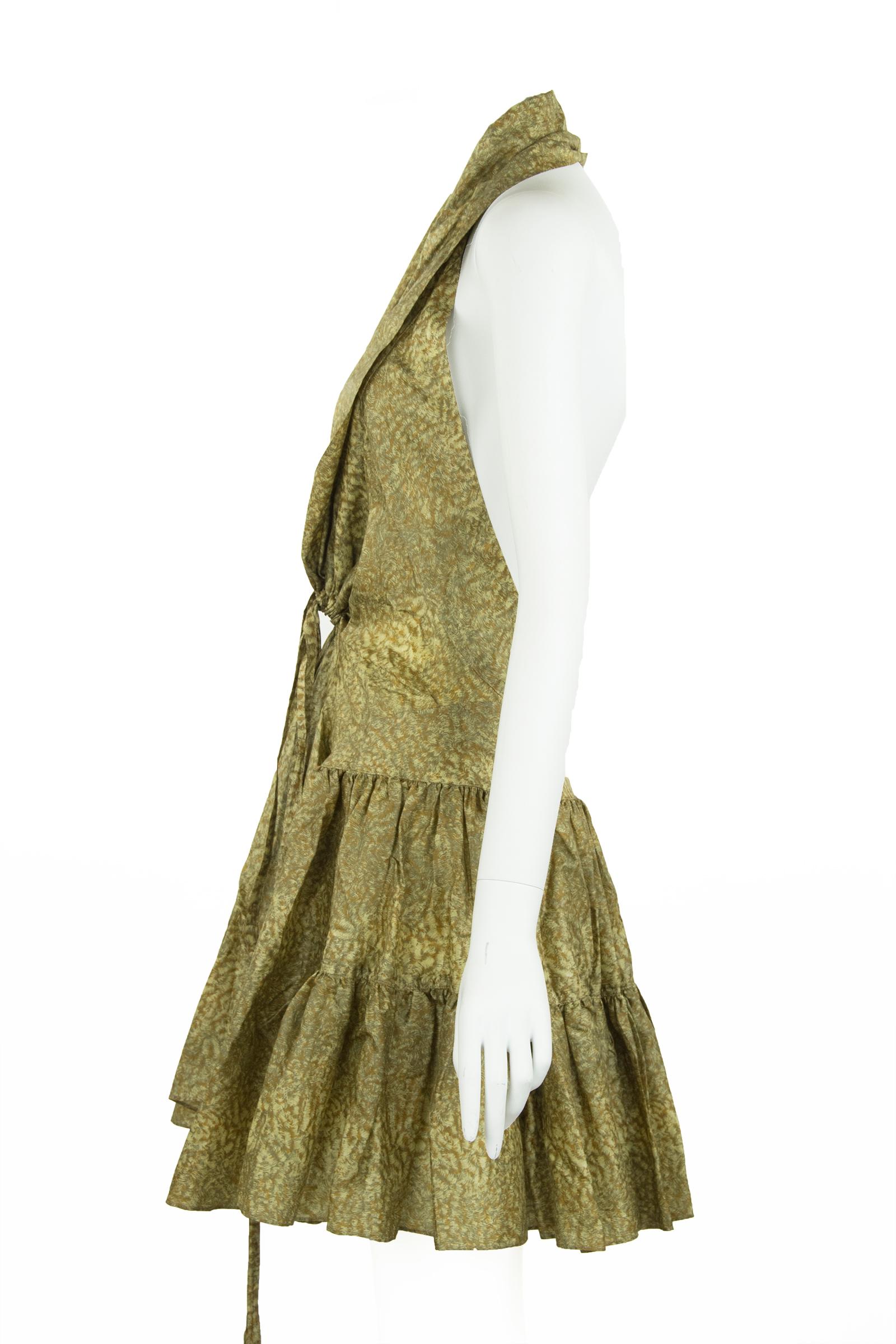 Fun and flirty Alaia printed silk dress in beautiful shades of green and brown.  Features a halter neck and ruffle tiers on the skirt.  Ties in the front.  

Size: FR 44

Condition: Excellent condition

Composition: 86% silk, 14% acrylic

Care: Dry