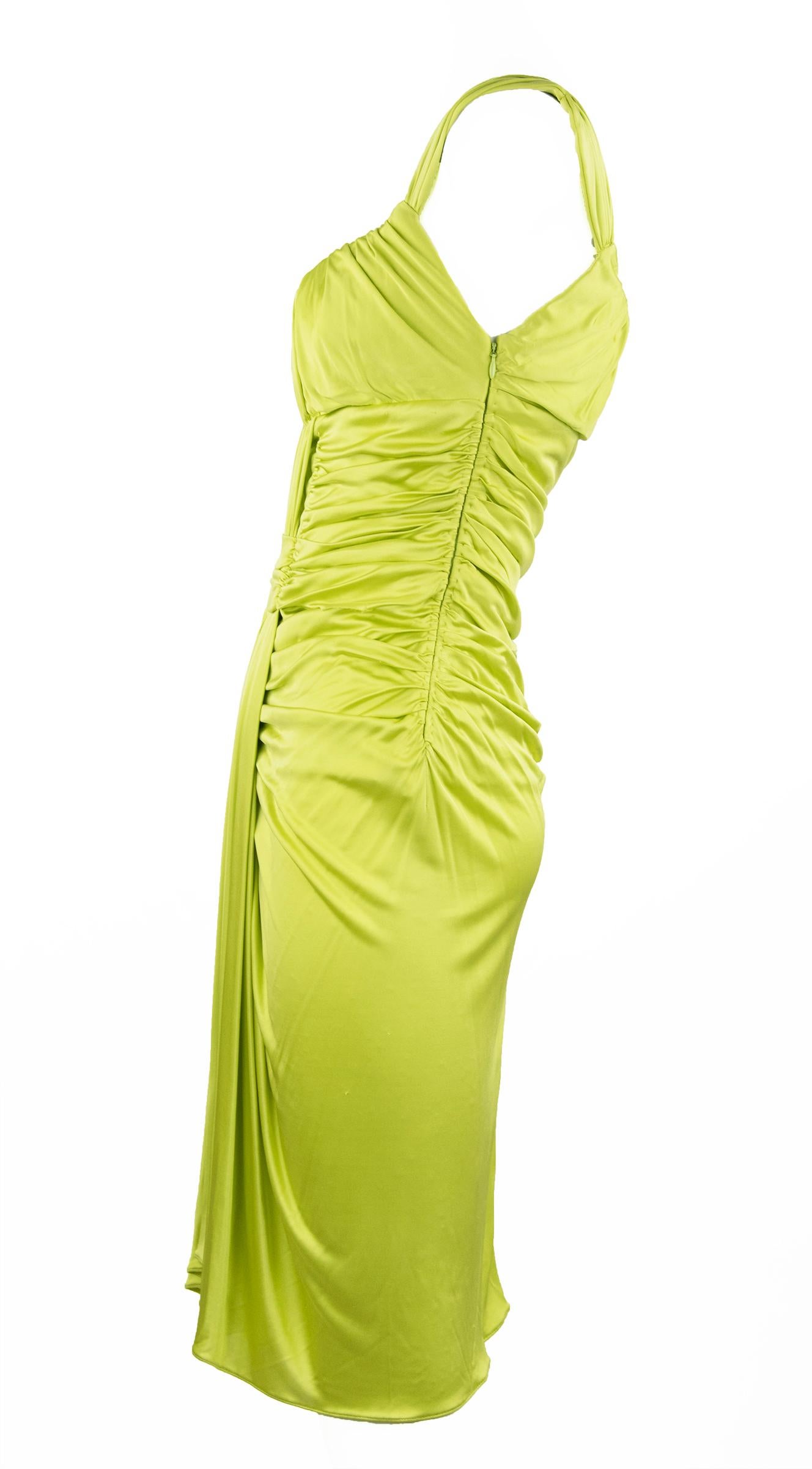 Fun and vibrant bright green silk jersey Emanuel Ungaro cocktail dress.  Beautiful draping and gathering throughout the dress and fitted for a sexy silhouette.  Perfect for a warm weather cocktail party.

Size: IT 40

Condition: New with