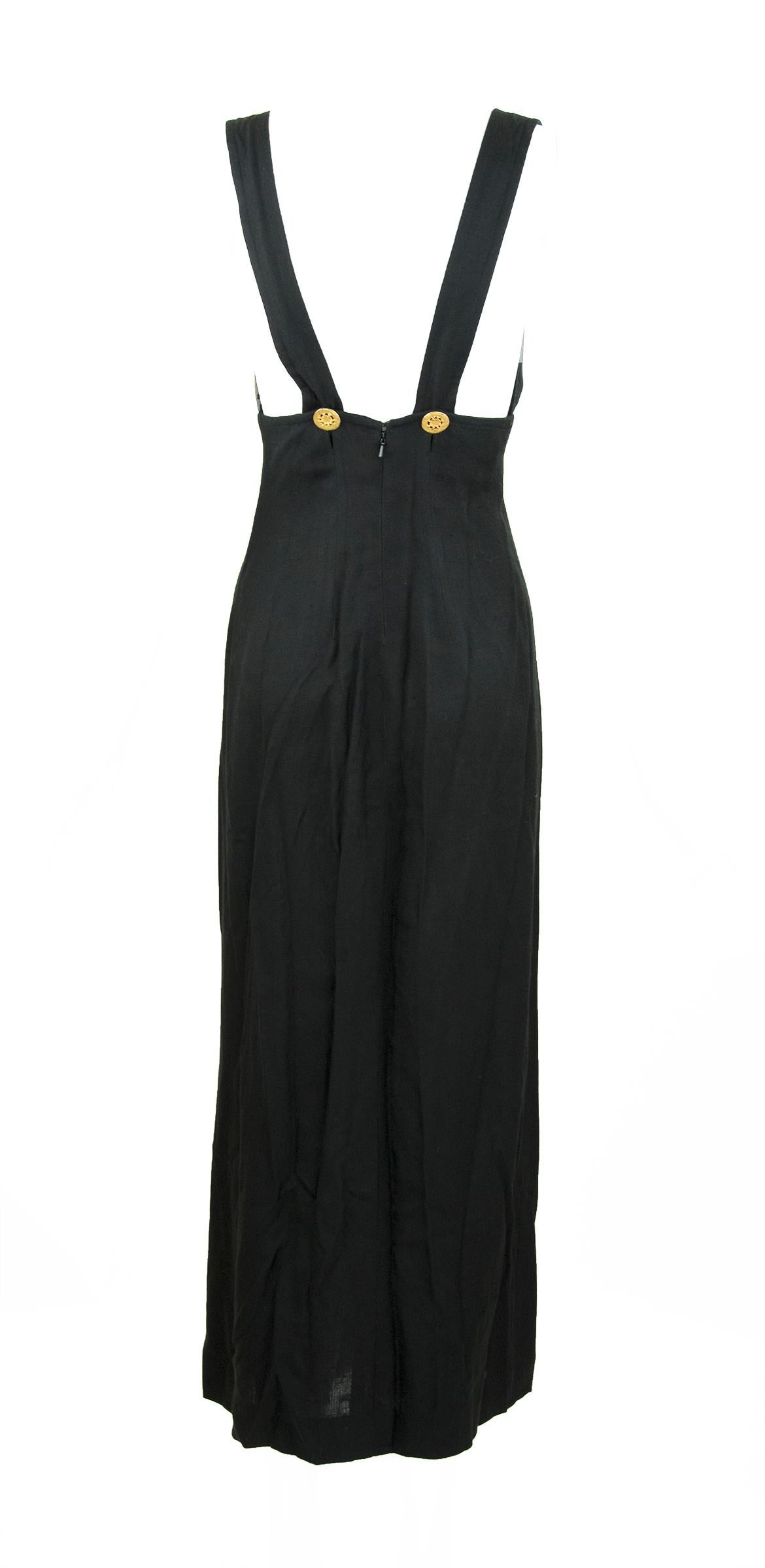 Incredible original Christian Lacroix long black dress with gold hardware detail between the bust.  Features two gold buttons on the back straps and a sexy high slit.

Size: FR 38

Condition: Pristine

Composition: 100% viscose

Made in France