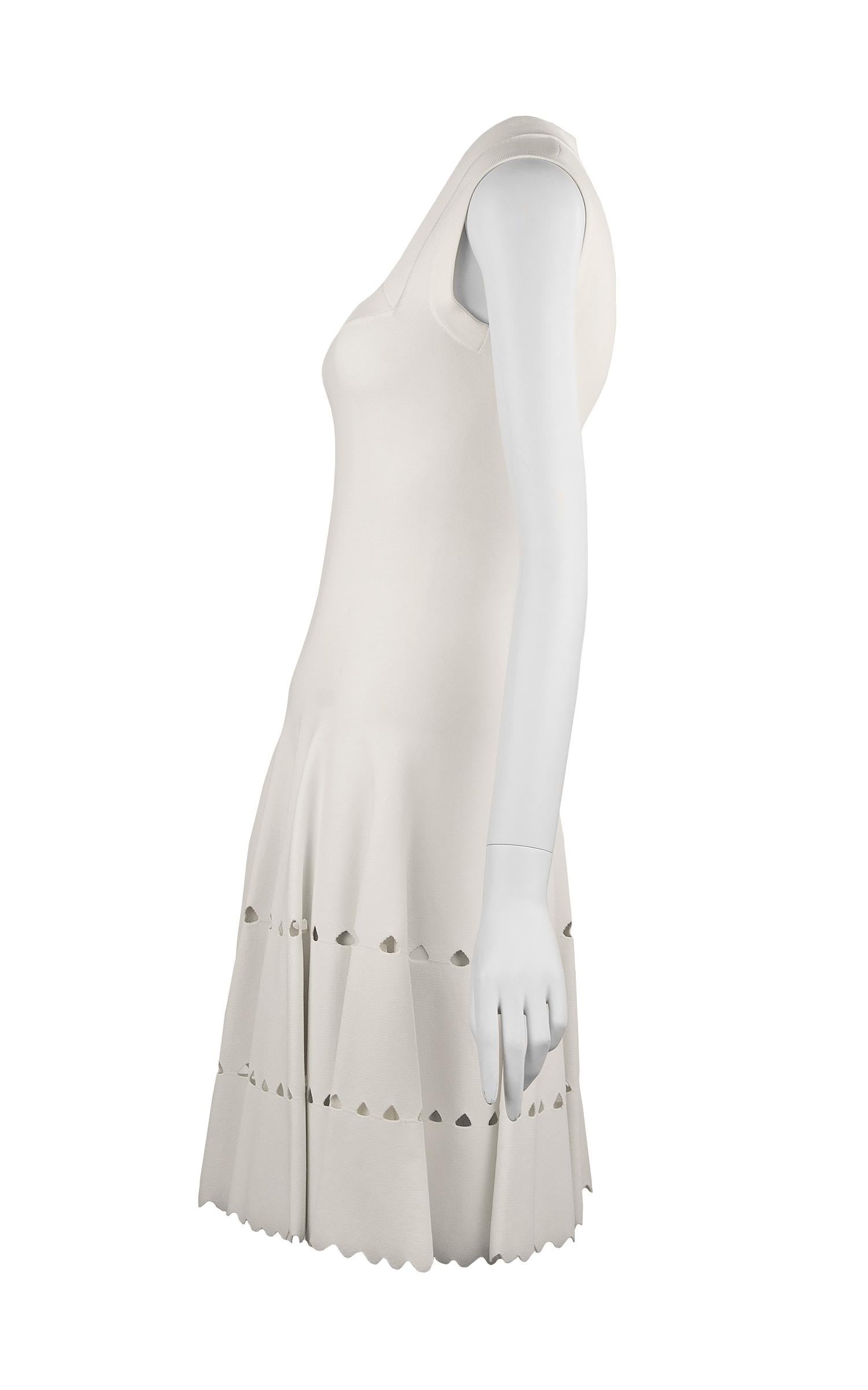 Gorgeous white Alaia fit and flare dress in a stunning knit fabric that has laser cut detail along the skirt.  Features a square neckline with a delicate scalloped finish on the edges. 

Size: FR 36

Condition: New with tags

Composition: 85%