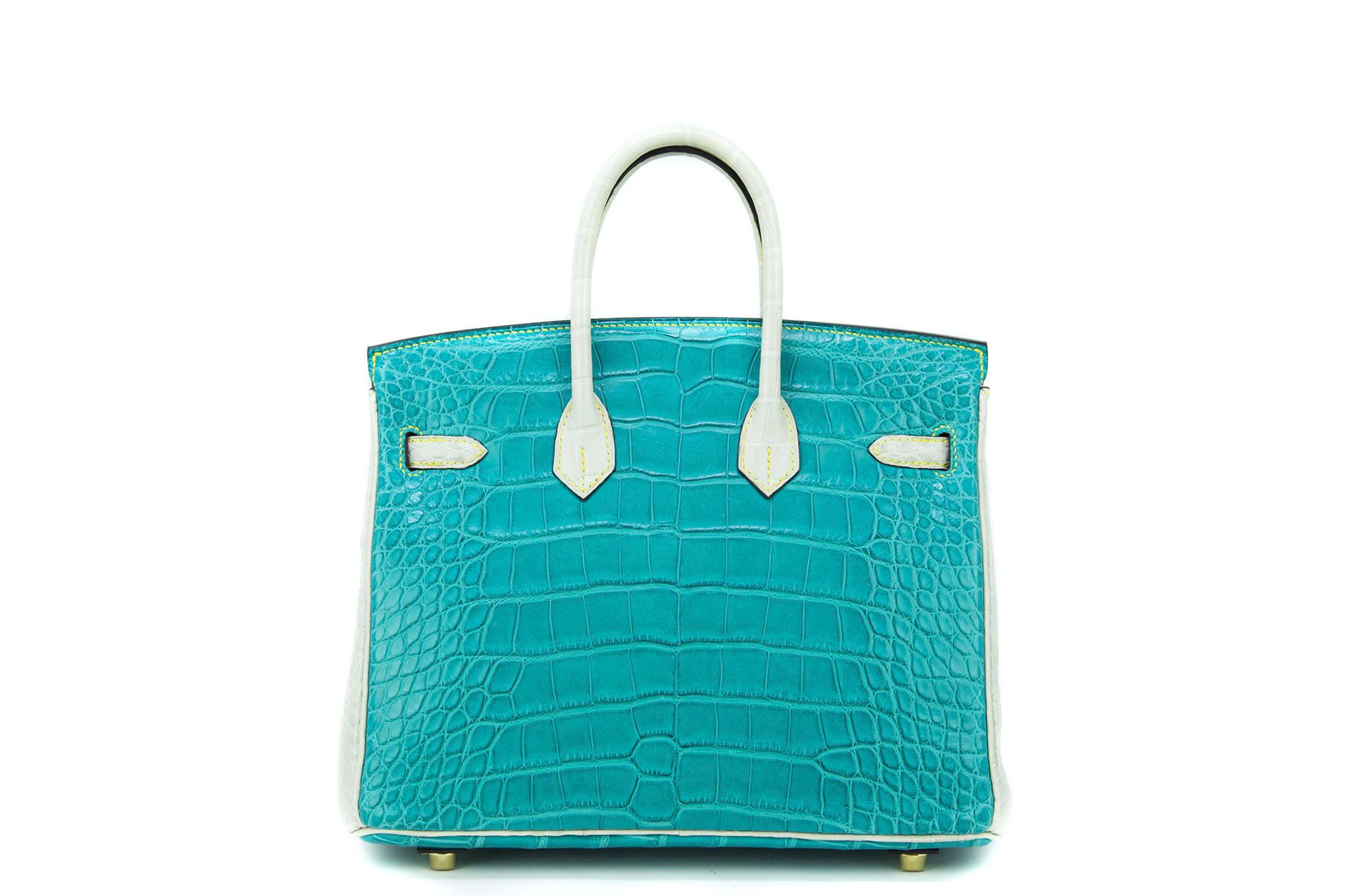 The gorgeous and unique color combination on this one of a kind horseshoe birkin makes it an incredibly striking piece.  Features turquoise alligator with gray accent leather and yellow topstitching.  This is a brand new bag with plastic on the