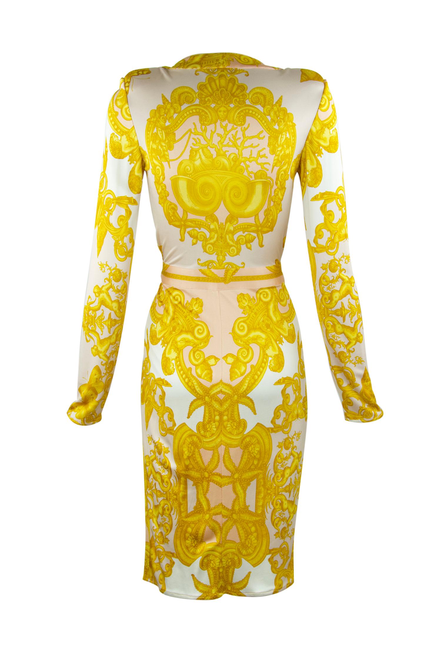 Iconic wrap dress made of sexy silk jersey, featuring a v neckline and long sleeves.  This Versace print is hard to miss, composed of gorgeous white, gold and light pink.  Signature medallion belt.

Size: IT 42 (the last picture shows size IT 40, as