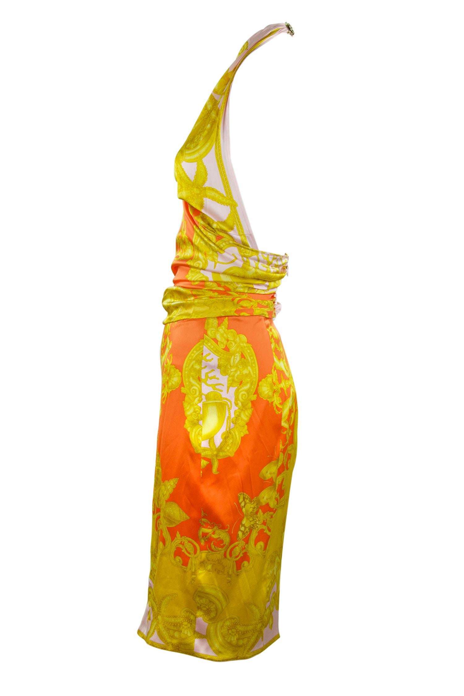 This sexy silk charmeuse halter dress embodies everything Versace.  Signature print in gorgeous bright orange, gold and pink made of stretch silk.  Signature medallion closure at the back of the neck.

Size: IT 42 (the last picture shows size IT 40,