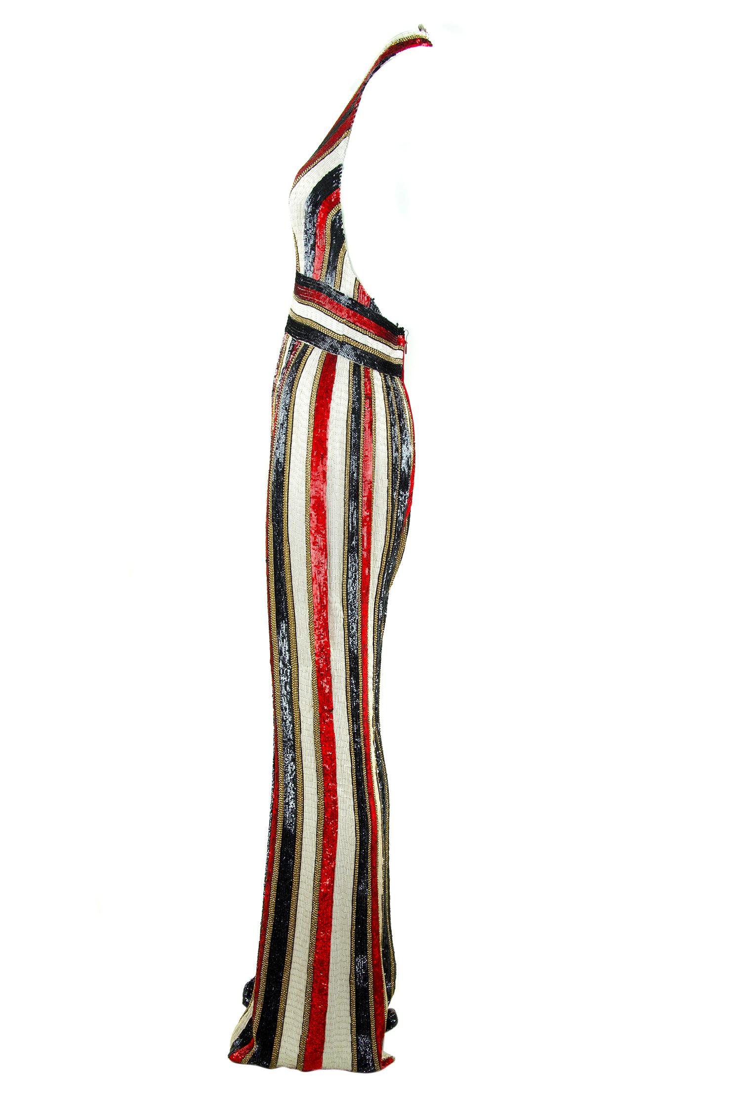 This jumpsuit is truly a work of art, something to be worn to a high profile art party or turn heads at a black tie.  The most incredible craftsmanship and detail on this beaded piece, with alternating striped of different color and shaped