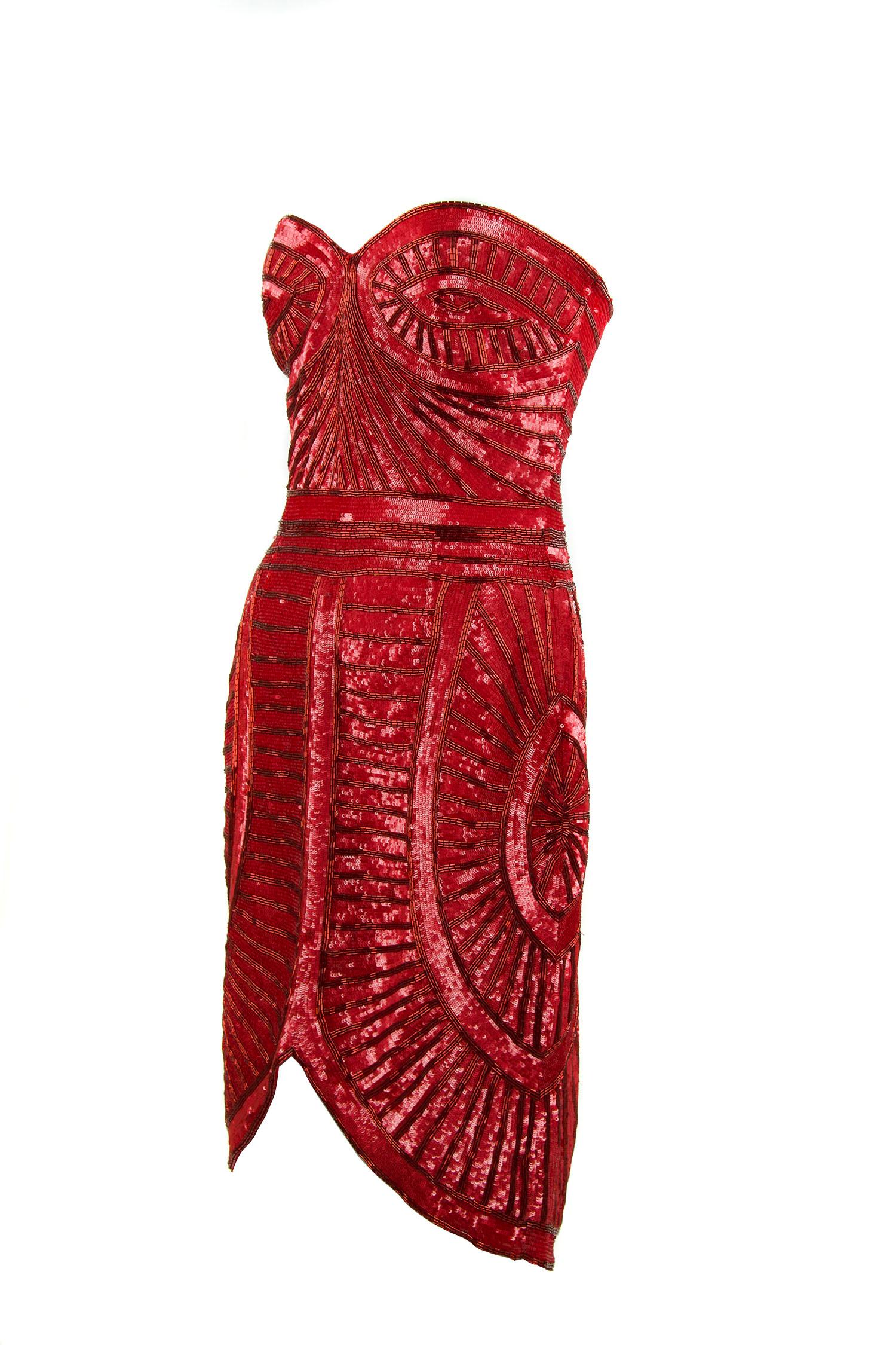 Incredible geometric beading on this Zuhair Murad red beaded cocktail dress with a sweetheart neckline and fitted silhouette.  In a beautiful deep red color, this dress is certain to shine at a cocktail or black tie event.  Features boning for extra